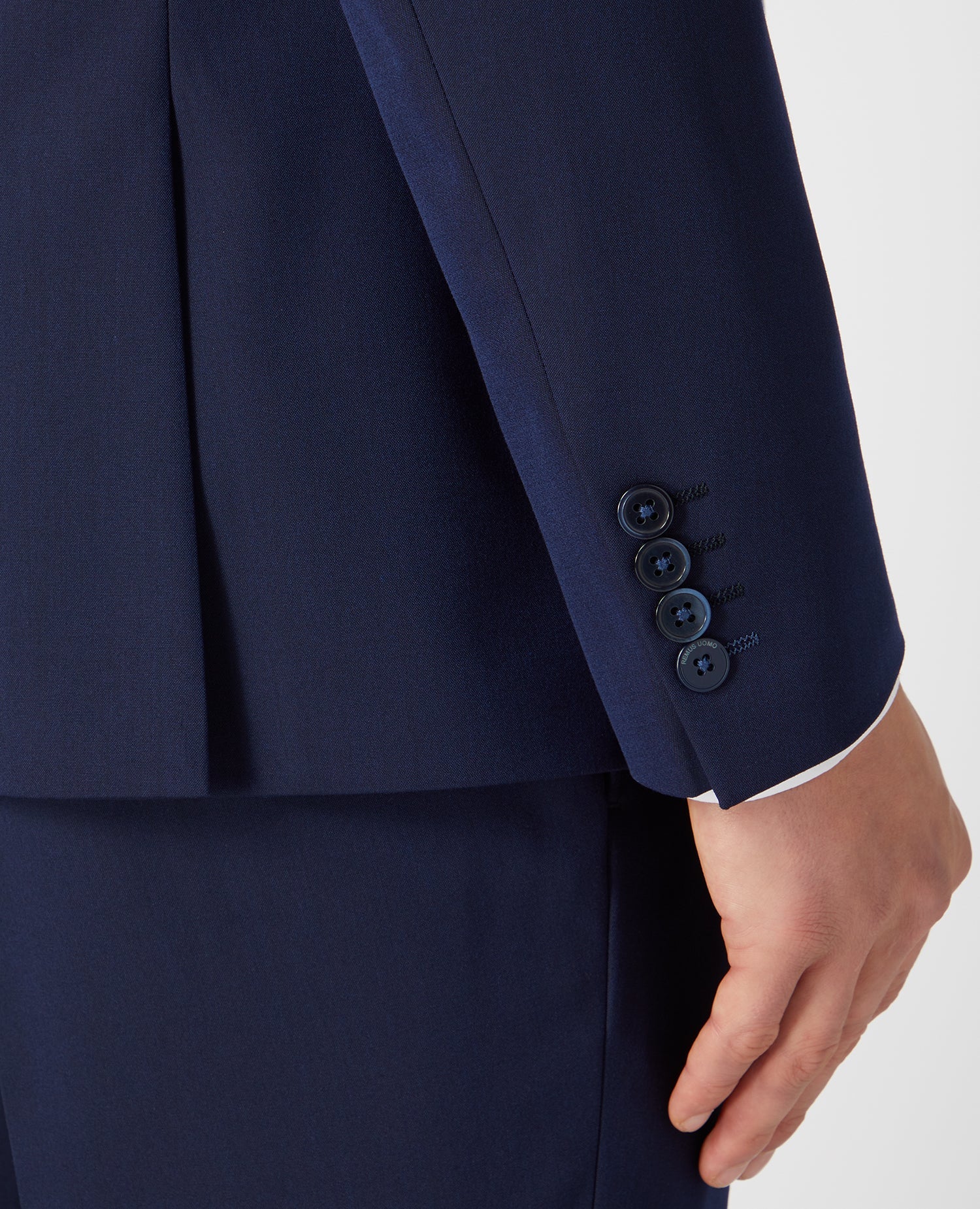 Man wearing a navy Slim Fit Stretch Mix and Match Suit Jacket