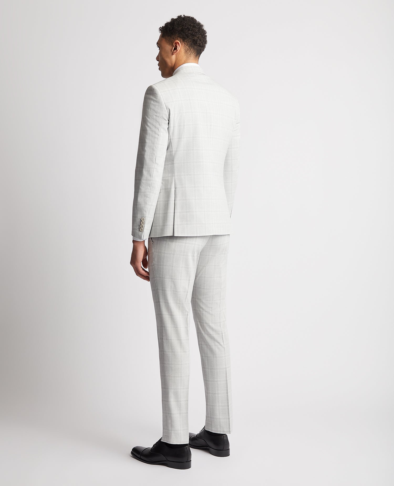 Man wearing a grey Slim Fit Stretch Suit Jacket