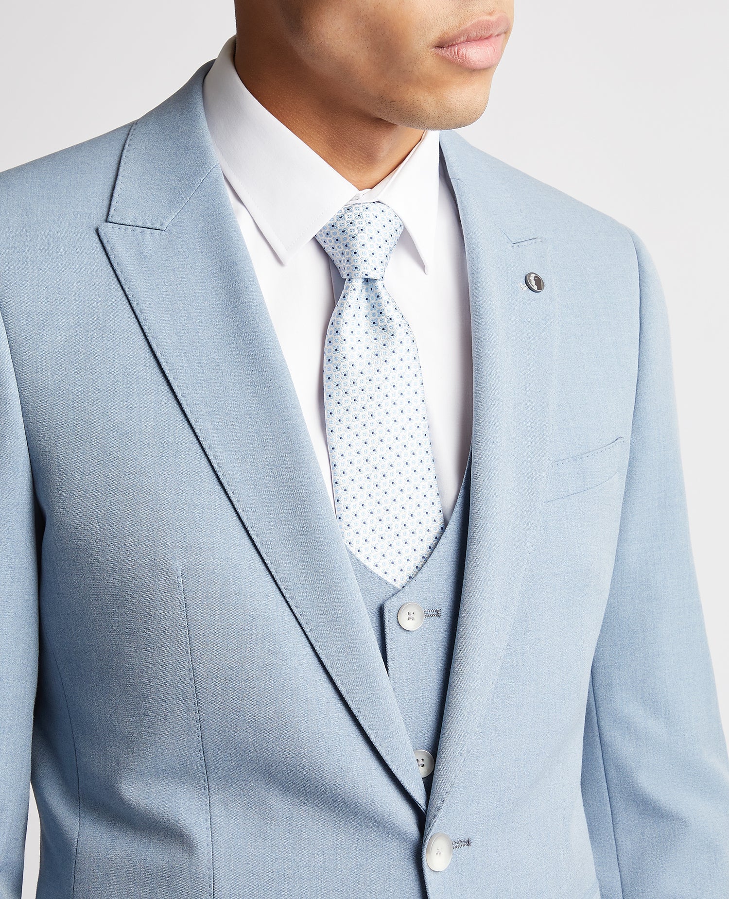 Man wearing a blue Slim Fit Stretch Suit Jacket
