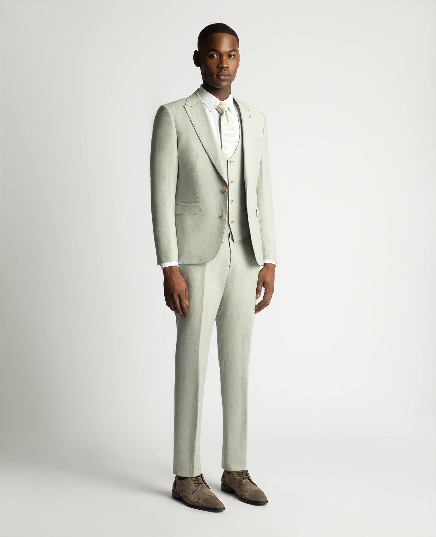 Man wearing a green Slim Fit Linen-Blend Suit