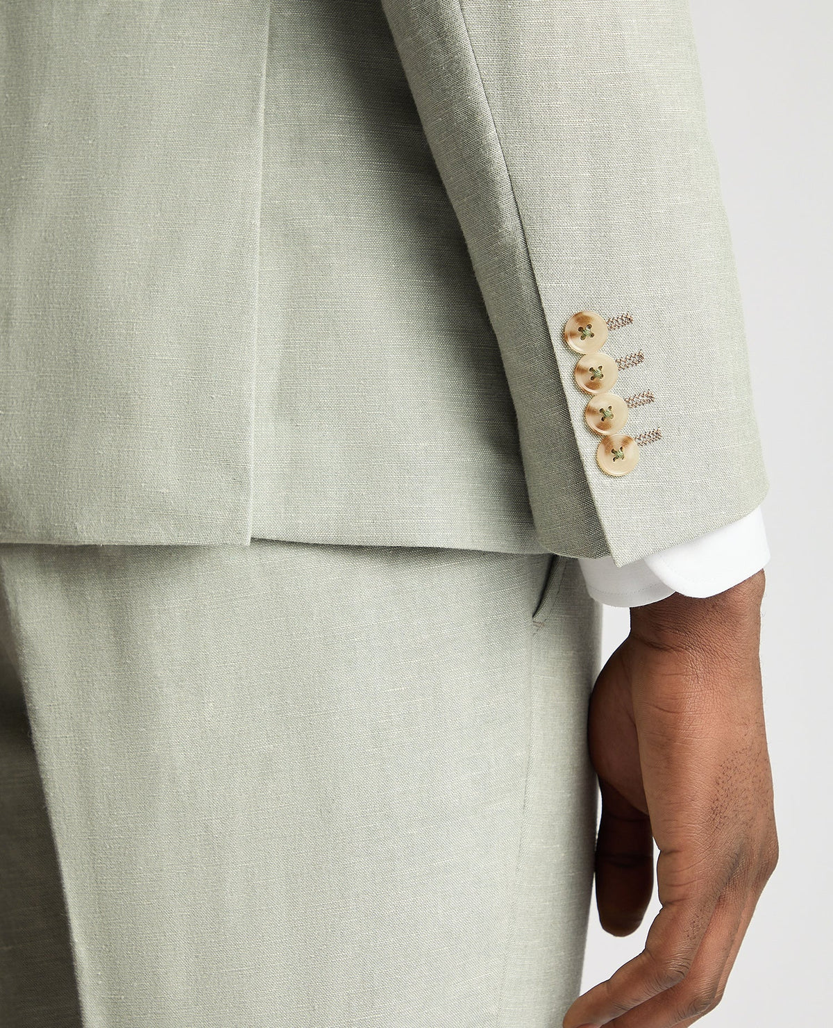Man wearing a green Slim Fit Linen-Blend Suit