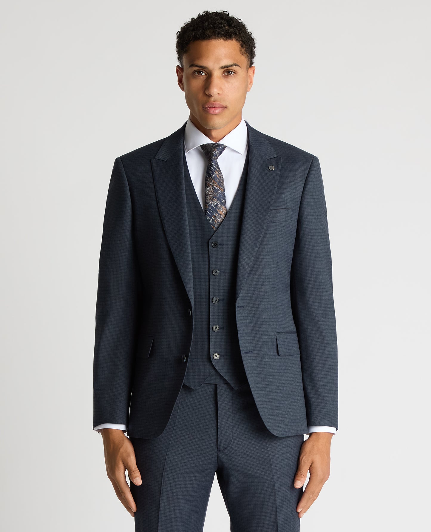 Man wearing a blue Tapered Fit Checked Stretch Suit