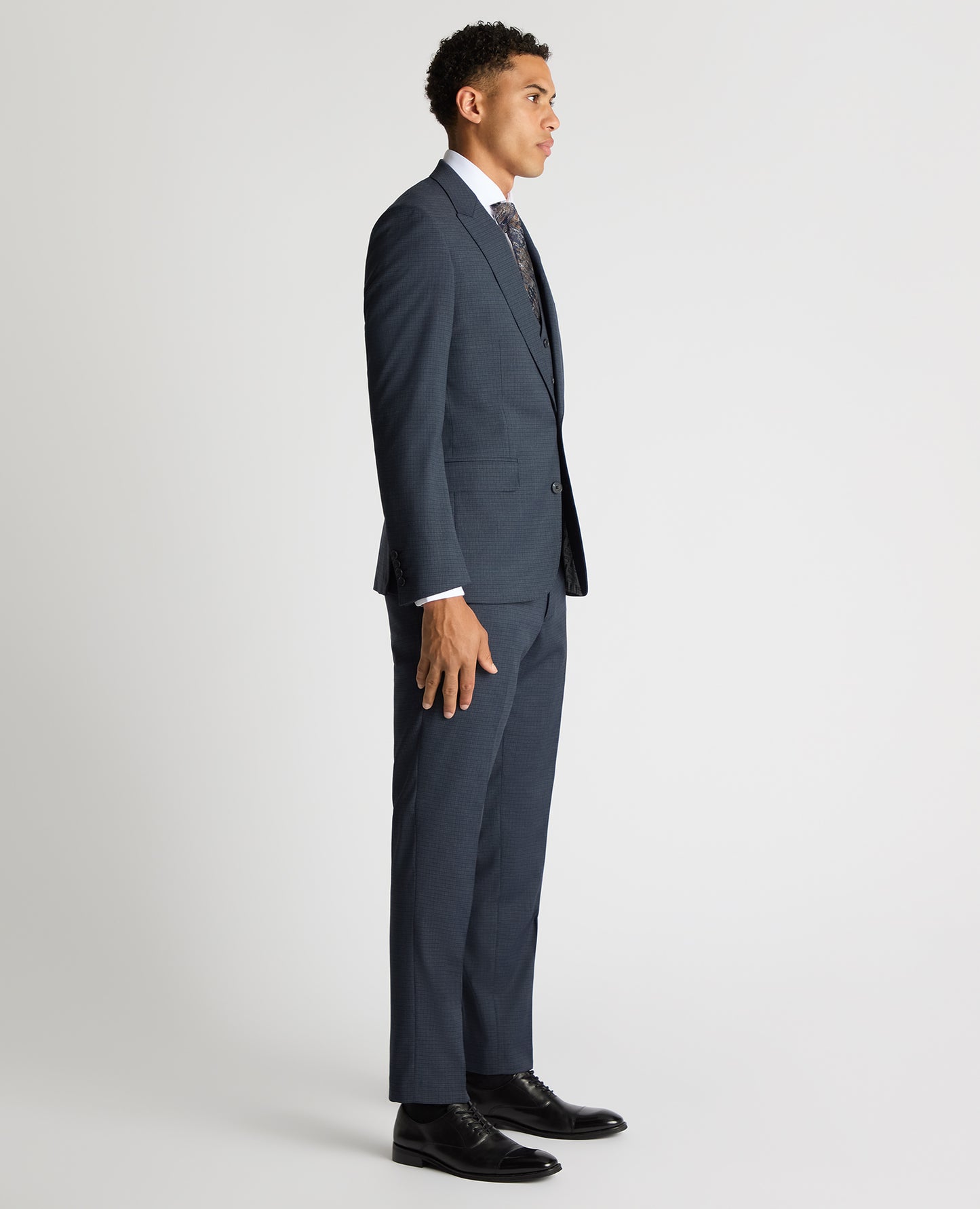 Man wearing a blue Tapered Fit Checked Stretch Suit