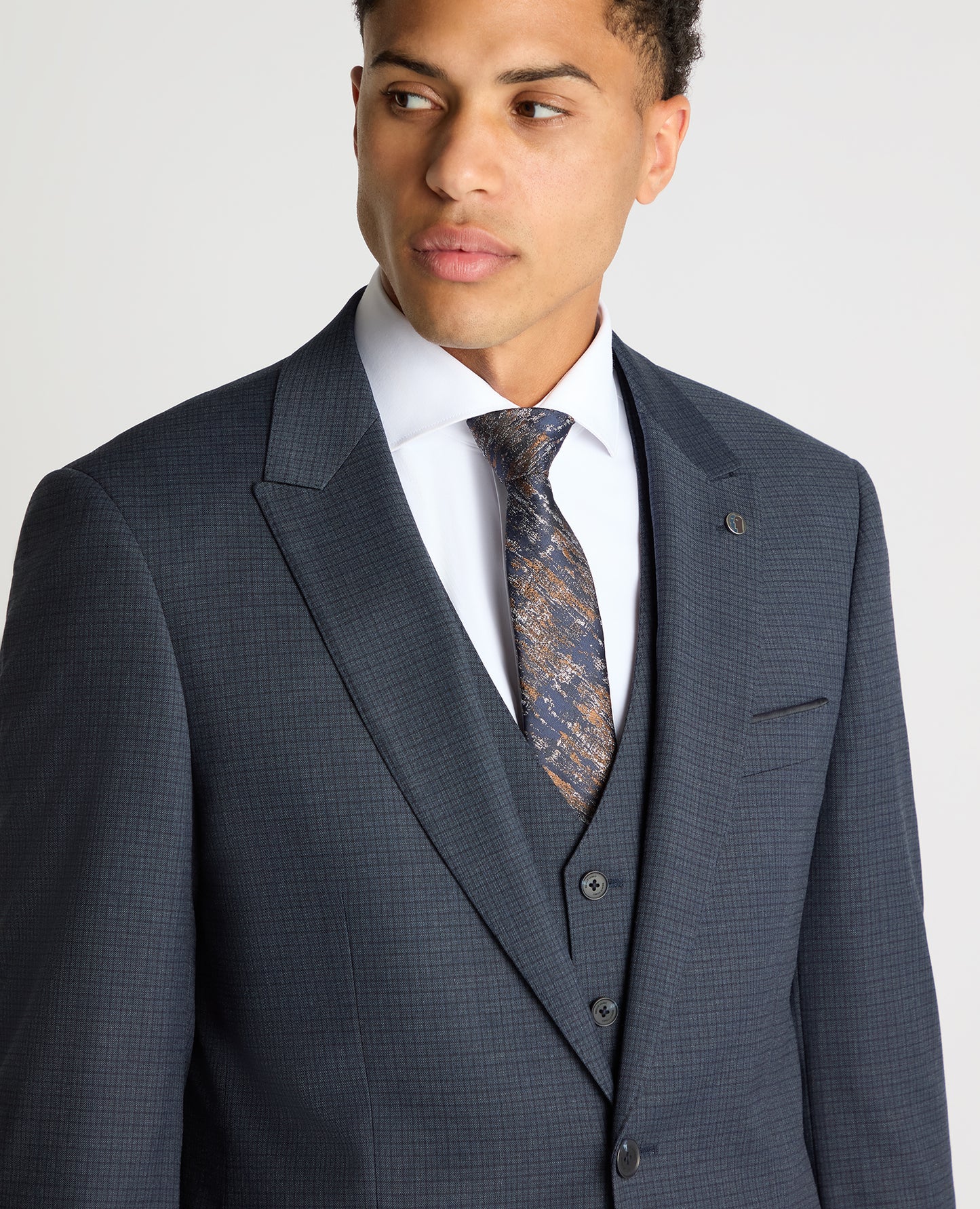 Man wearing a blue Tapered Fit Checked Stretch Suit