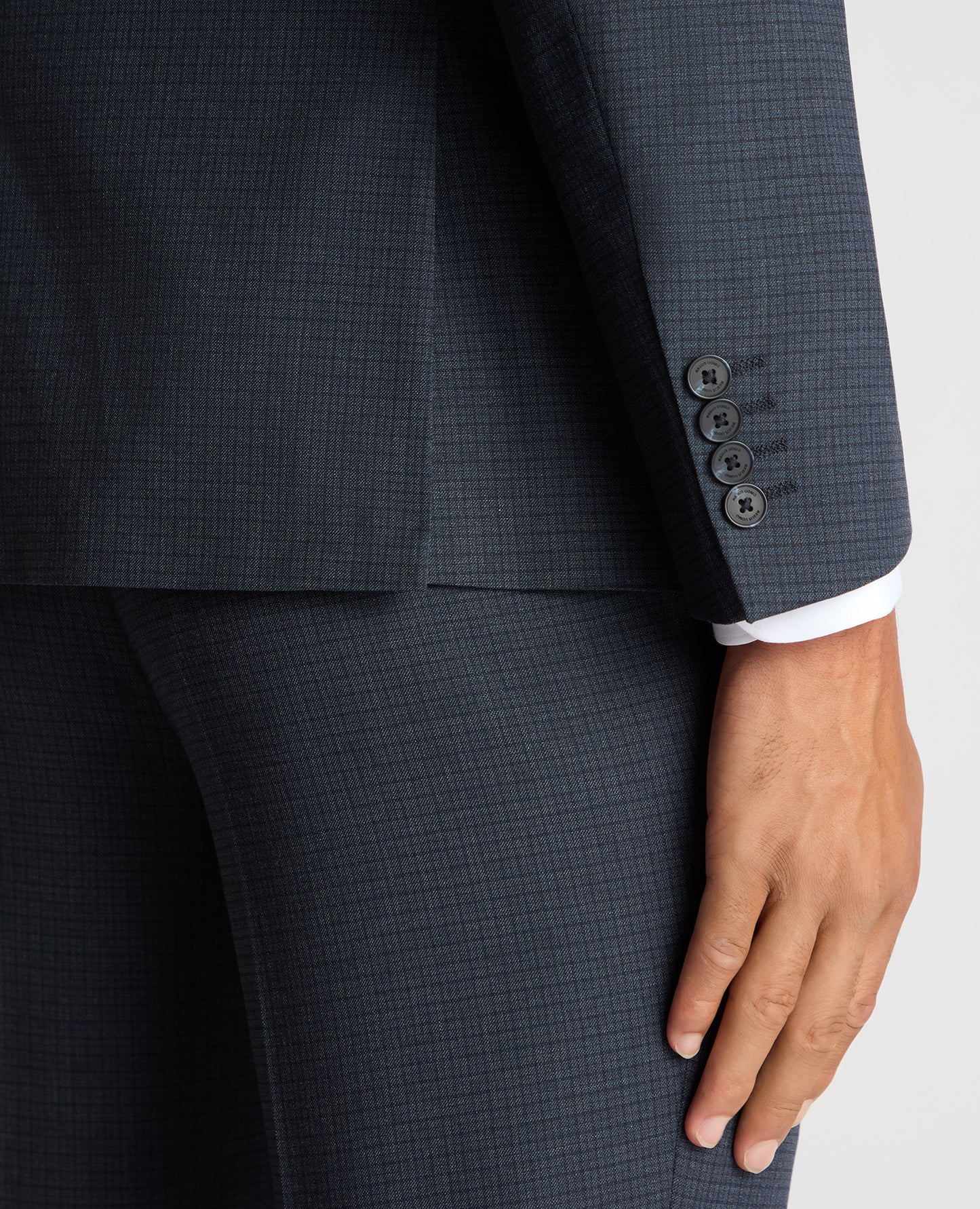 Man wearing a blue Tapered Fit Checked Stretch Suit