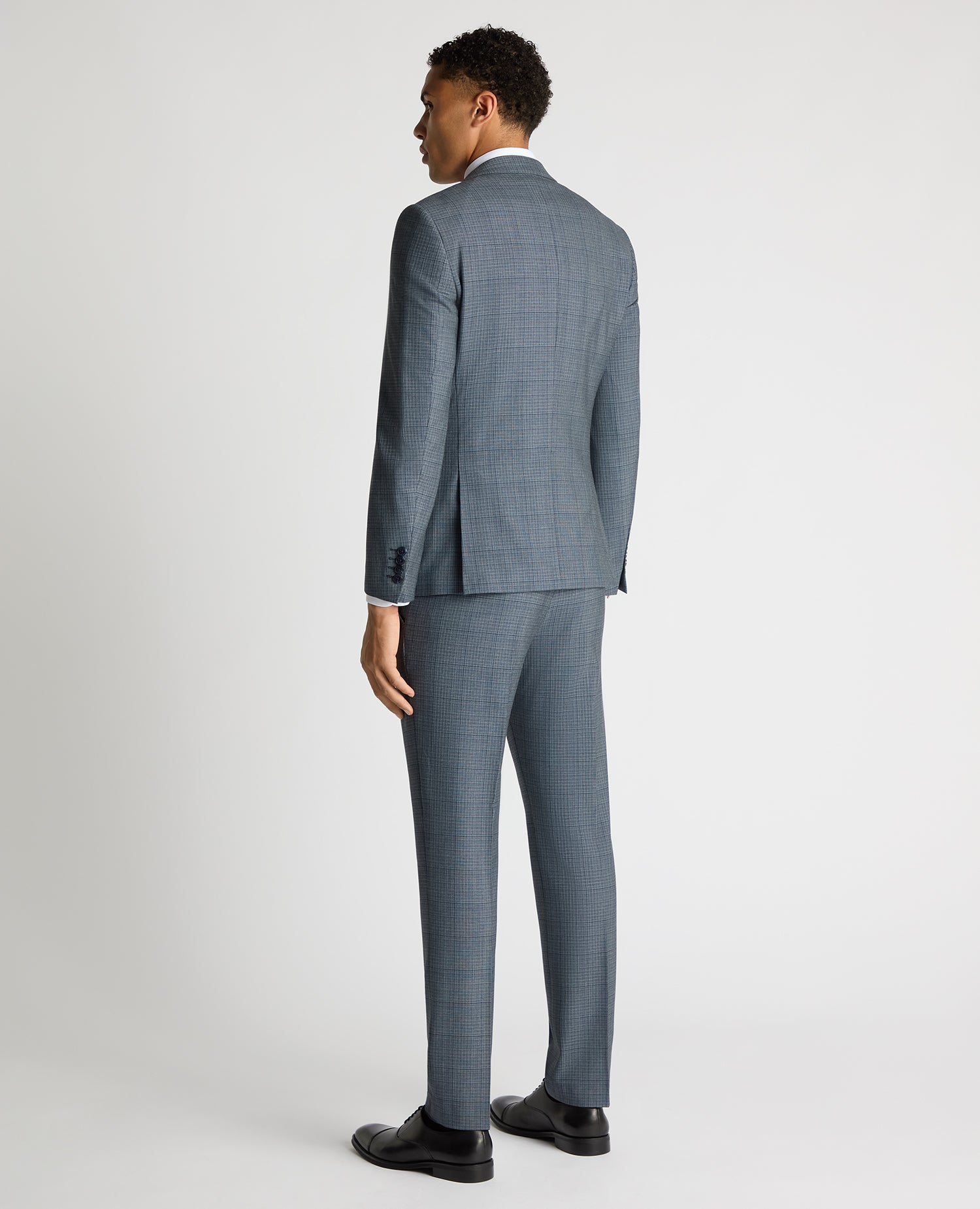 Man wearing a blue Slim Fit Checked Stretch Suit Jacket