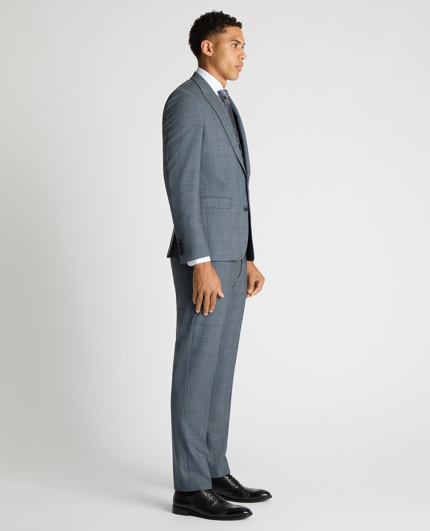 Man wearing a blue Slim Fit Checked Stretch Suit Jacket