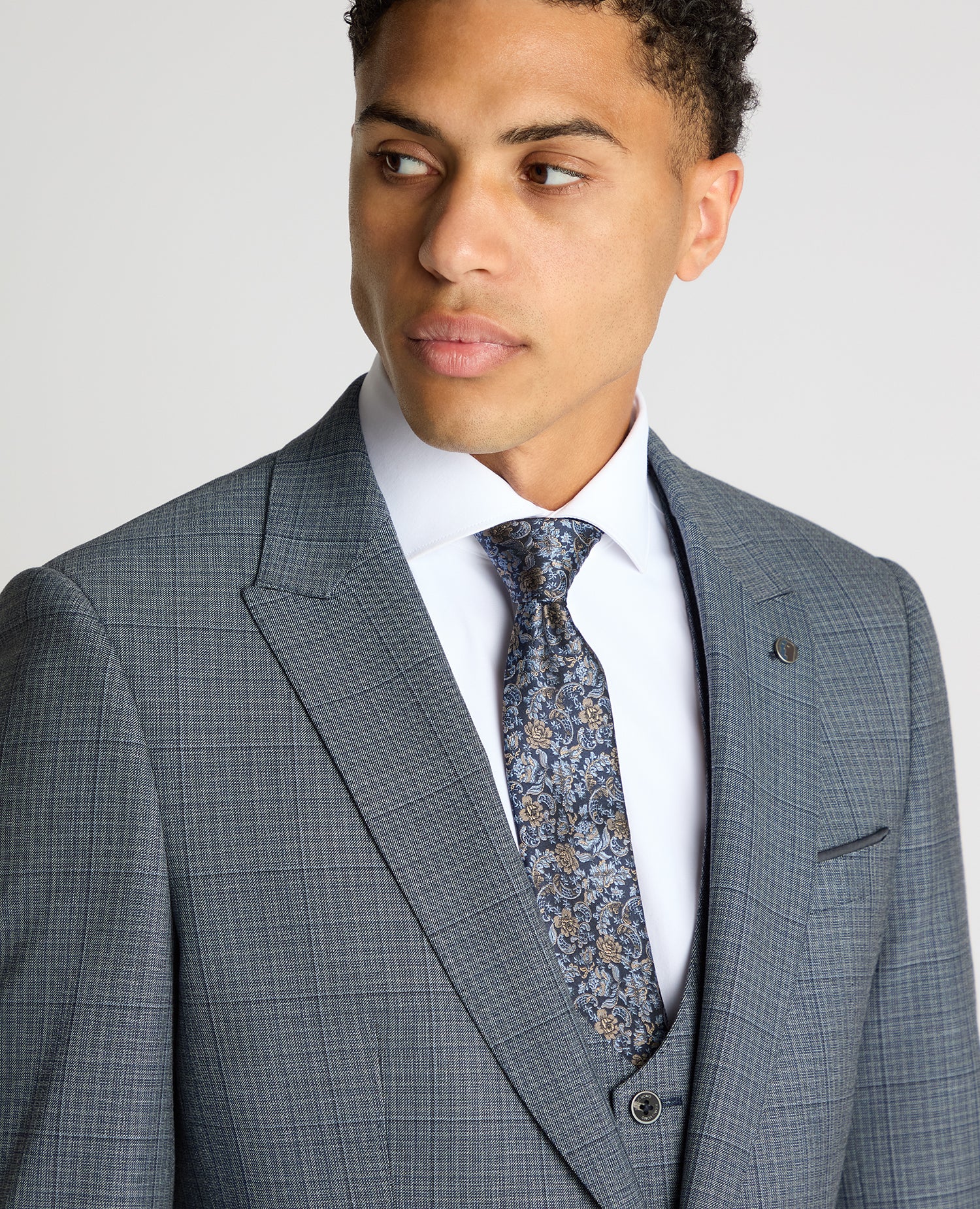 Man wearing a blue Slim Fit Checked Stretch Suit Jacket