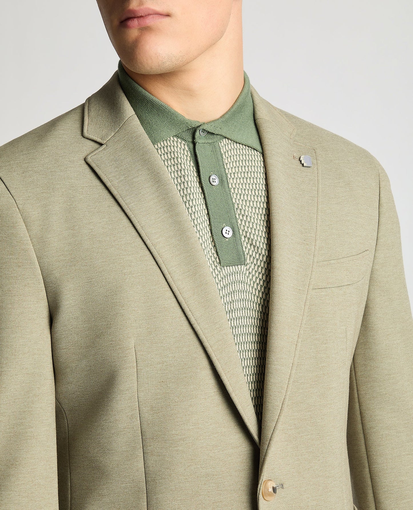 Man wearing a green Slim Fit Jersey Stretch Jacket