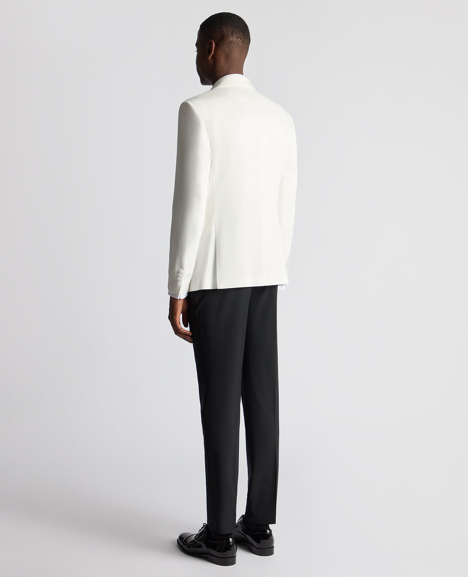 Man wearing a white Slim Fit Dinner Jacket