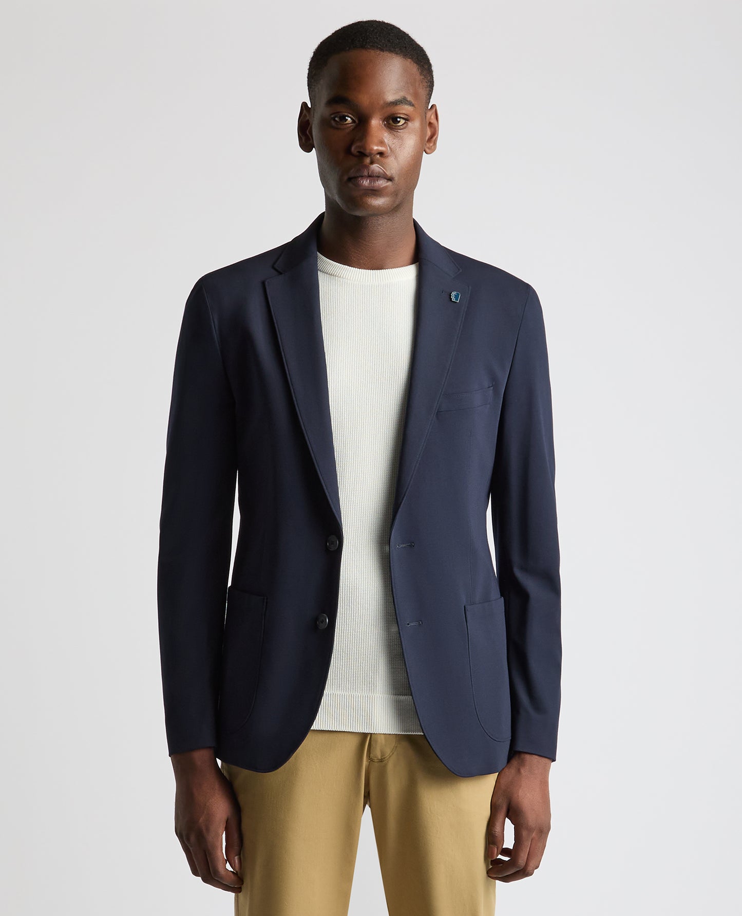 Man wearing a navy Tapered Fit Stretch Jacket