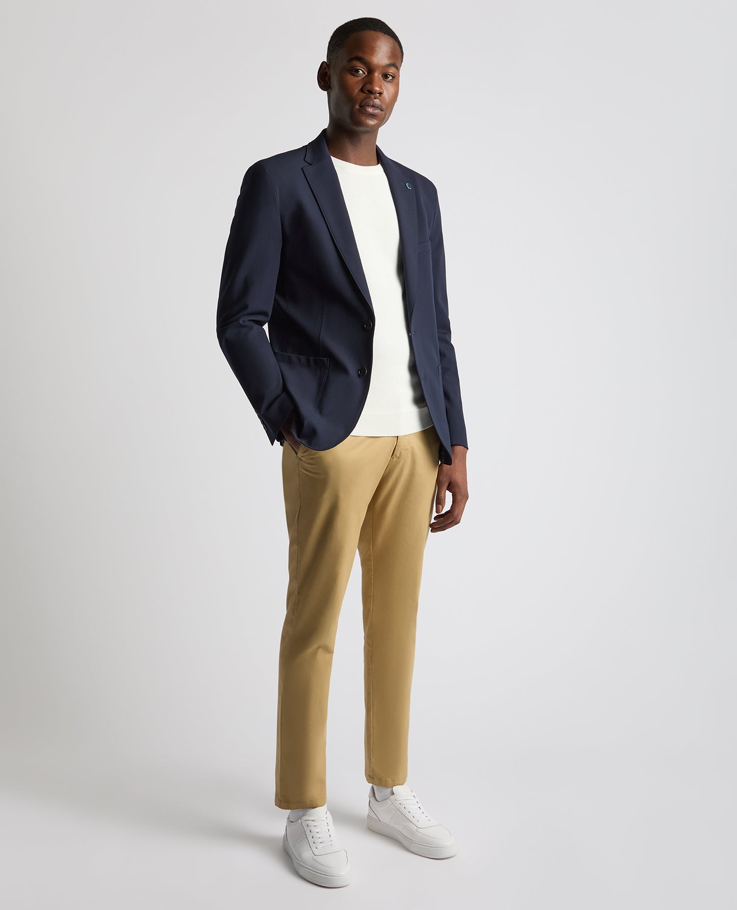 Man wearing a navy Tapered Fit Stretch Jacket