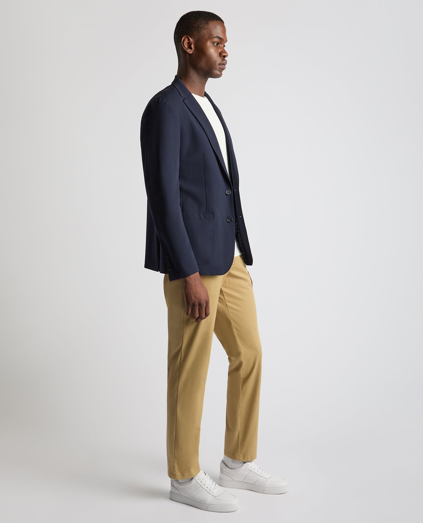 Man wearing a navy Tapered Fit Stretch Jacket