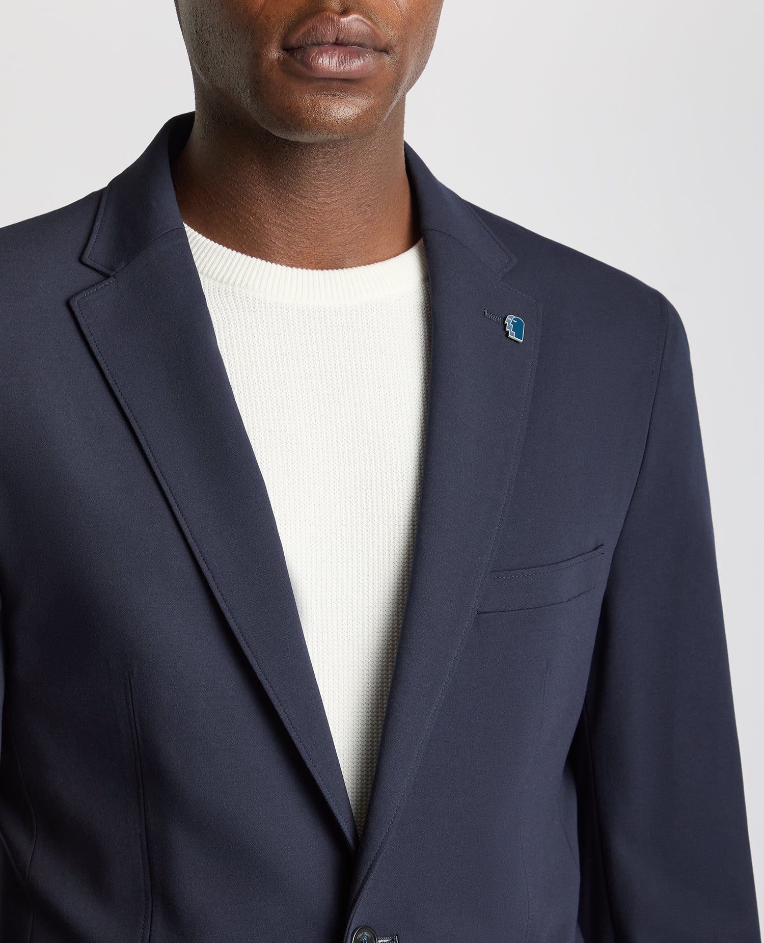 Man wearing a navy Tapered Fit Stretch Jacket