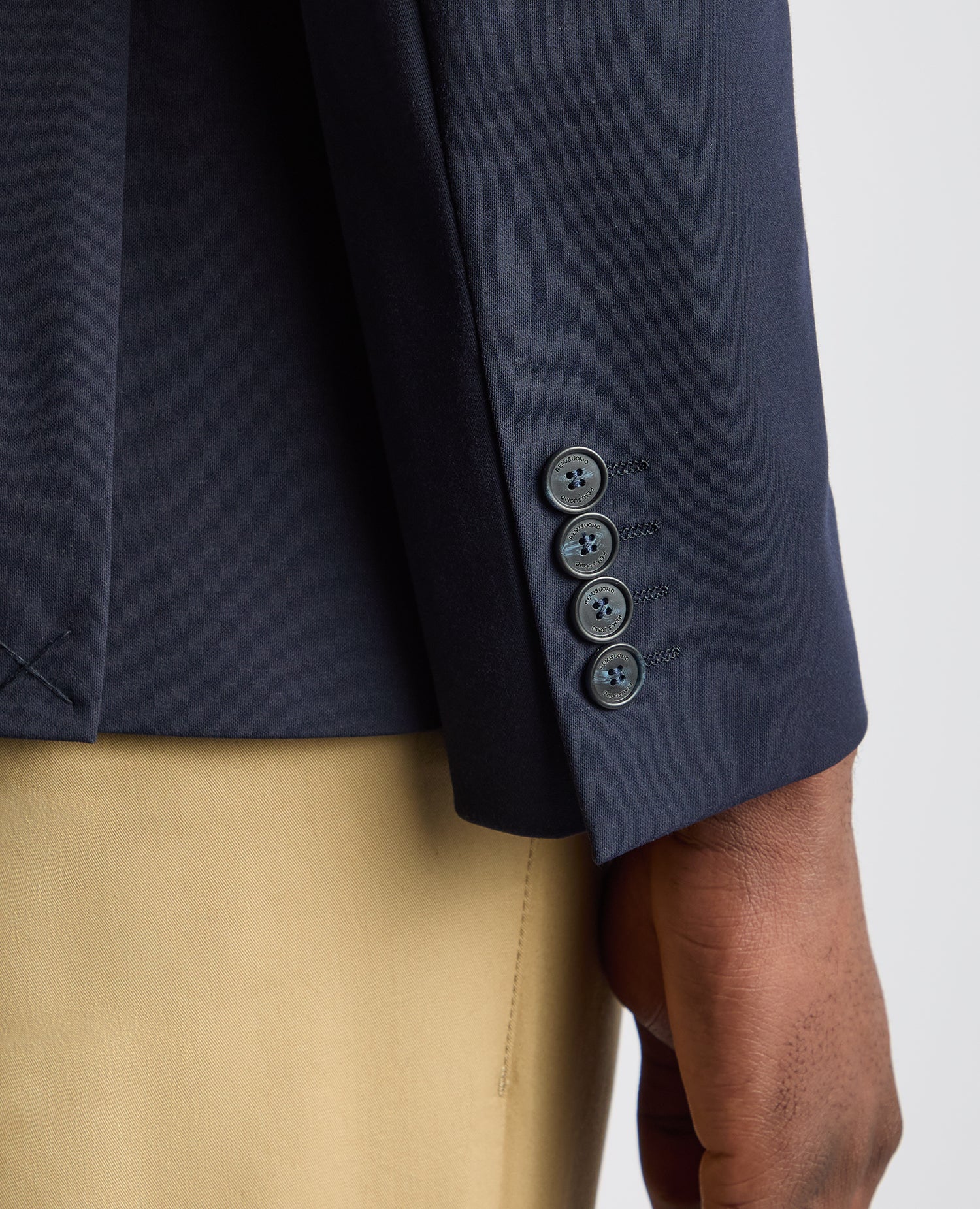 Man wearing a navy Tapered Fit Stretch Jacket