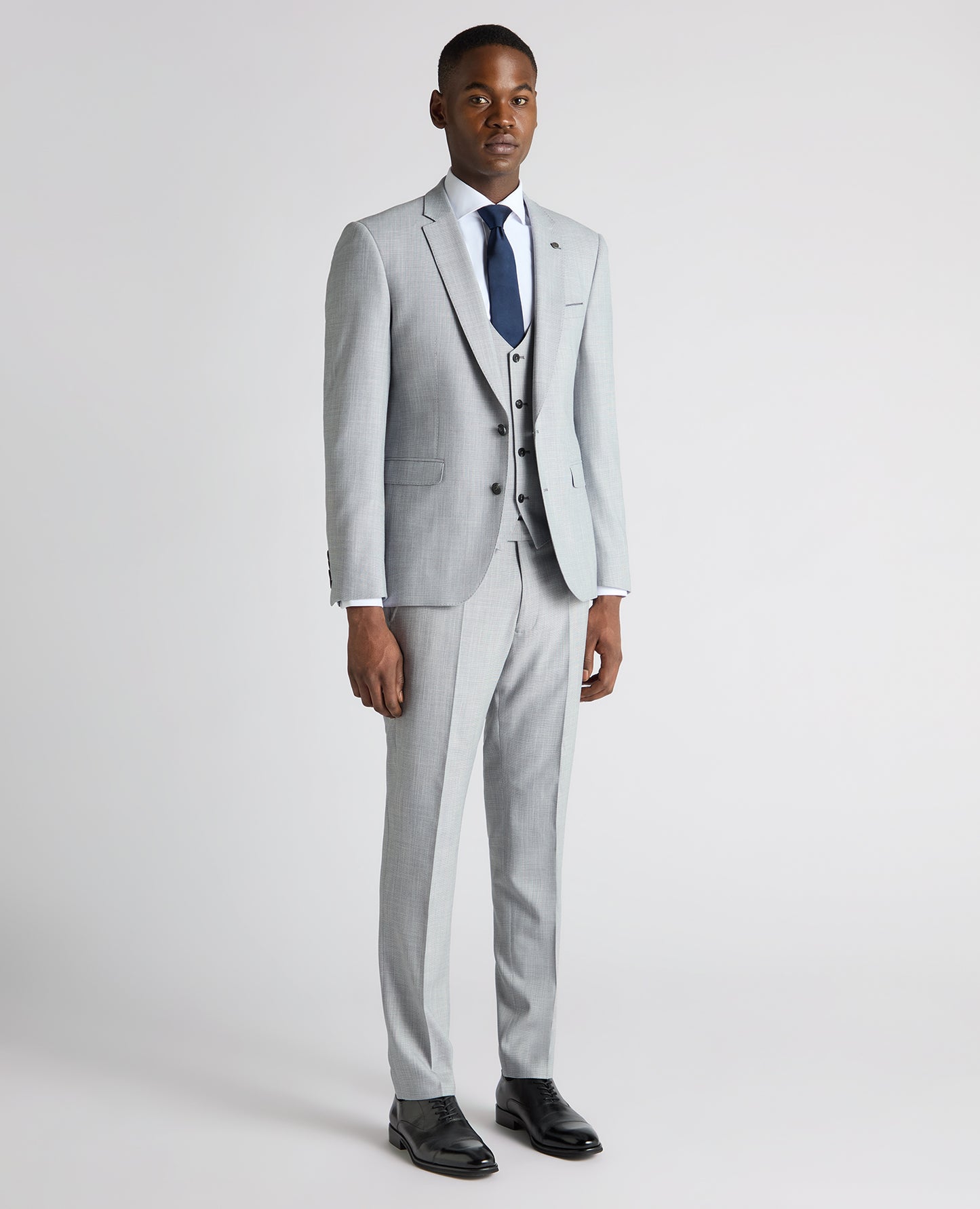 Man wearing a blue Slim Fit Micro Houndstooth Suit