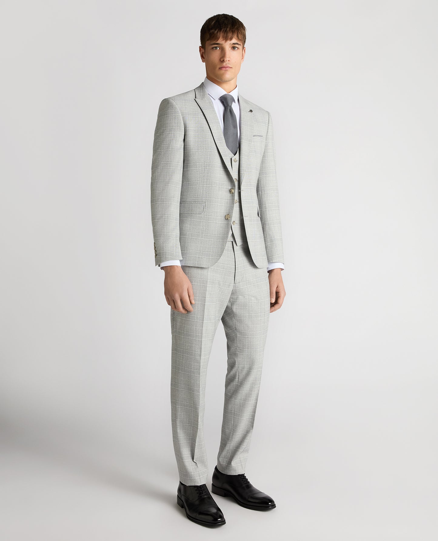 Man wearing a grey Slim Fit Checked Stretch Suit