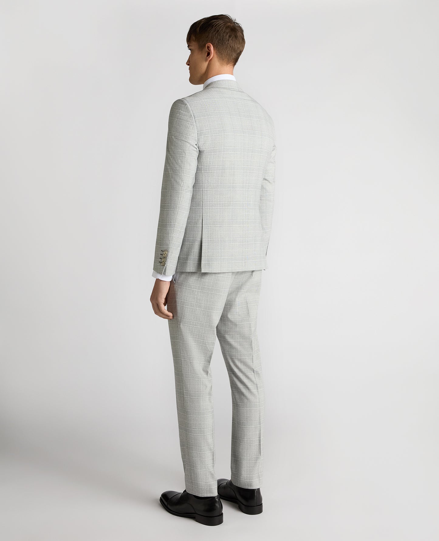 Man wearing a grey Slim Fit Checked Stretch Suit