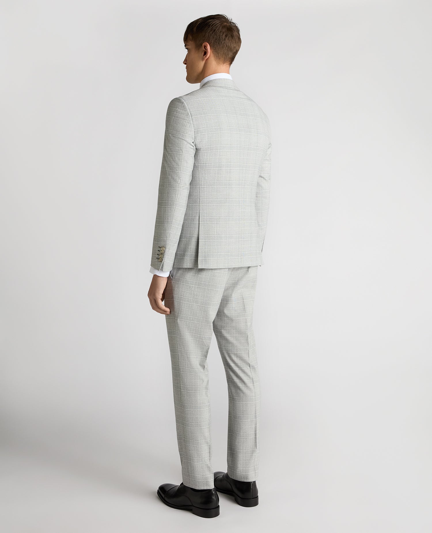 Man wearing a grey Slim Fit Checked Stretch Suit