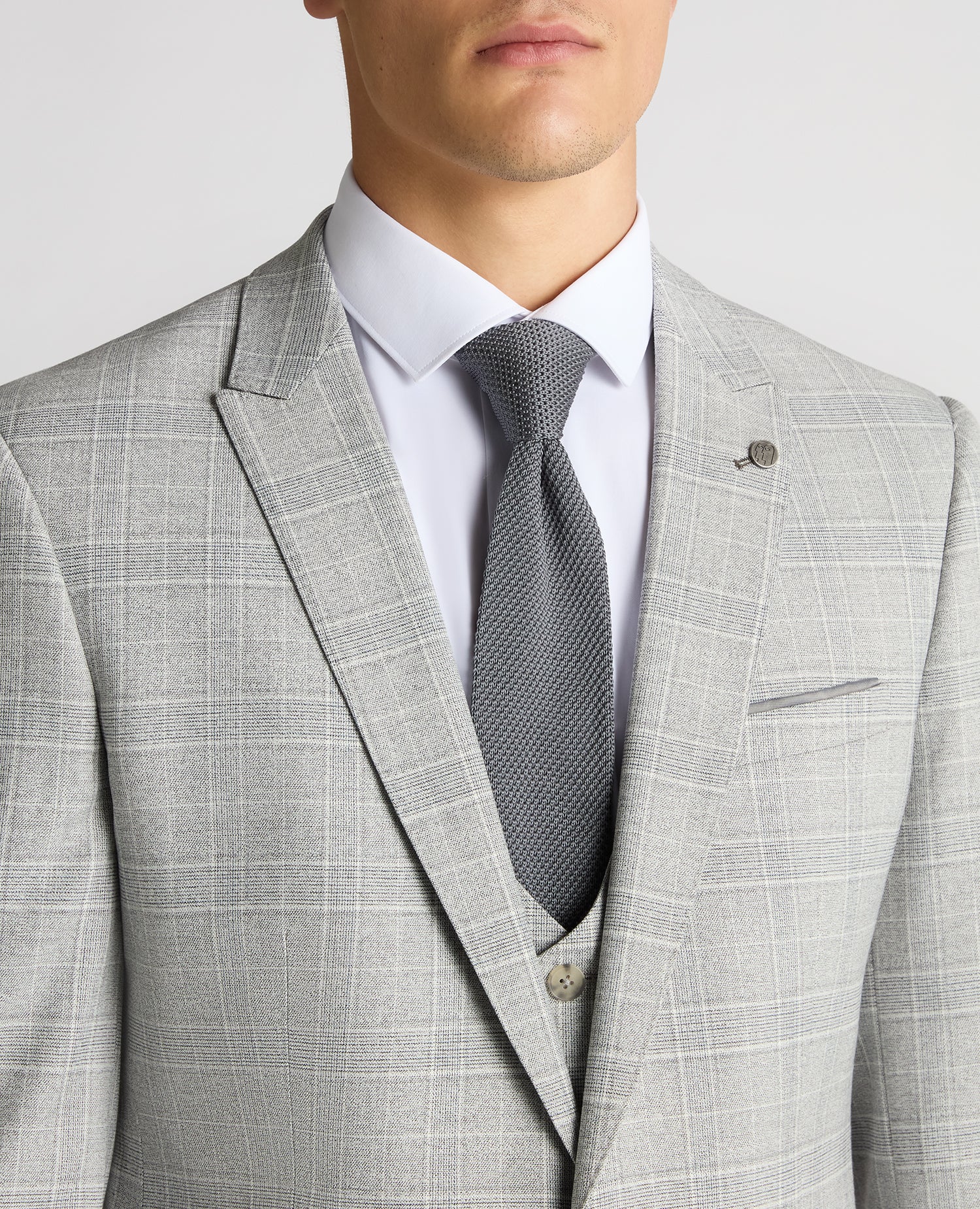 Man wearing a grey Slim Fit Checked Stretch Suit