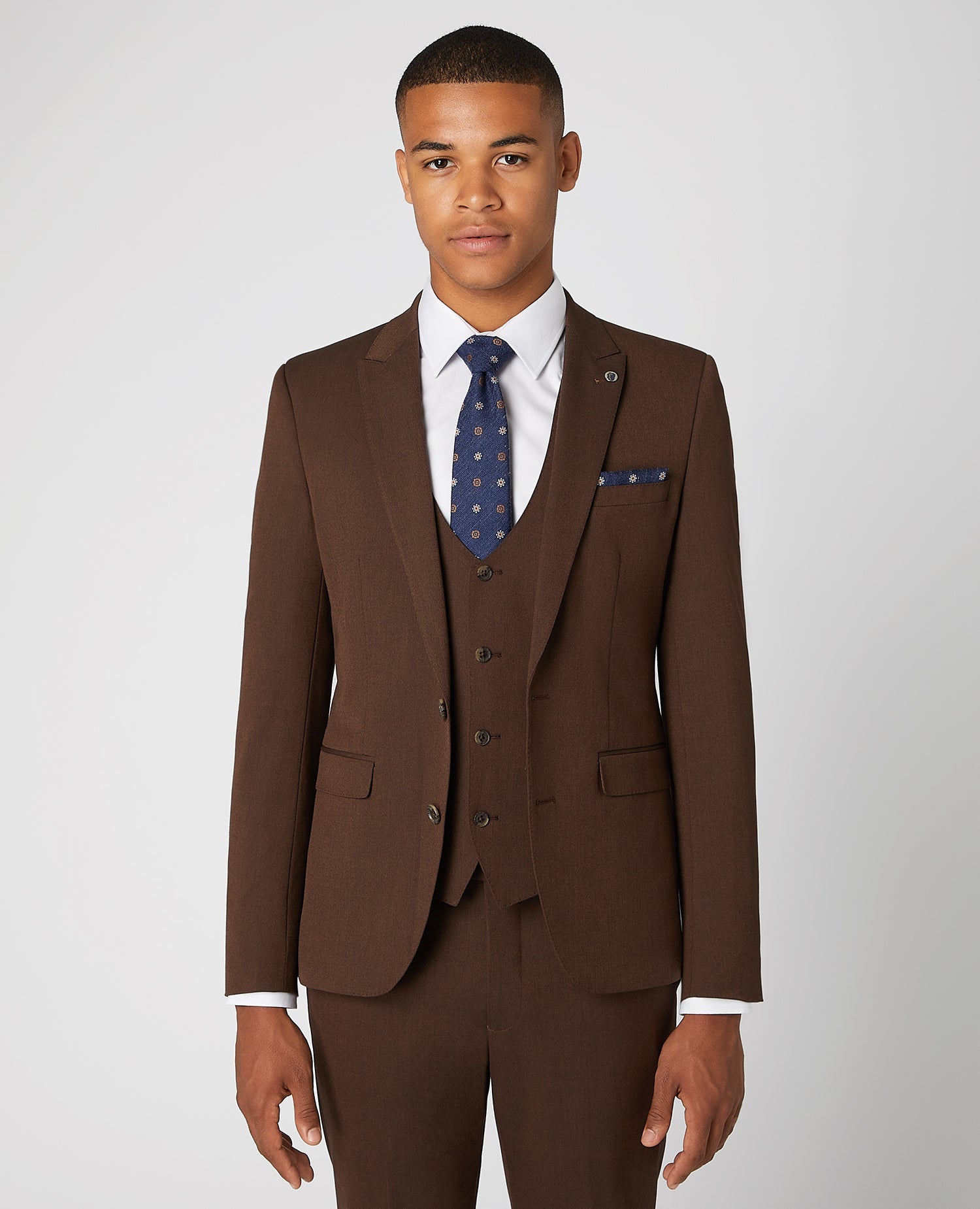 Man wearing a brown X-Slim Fit 2-Piece Stretch Suit