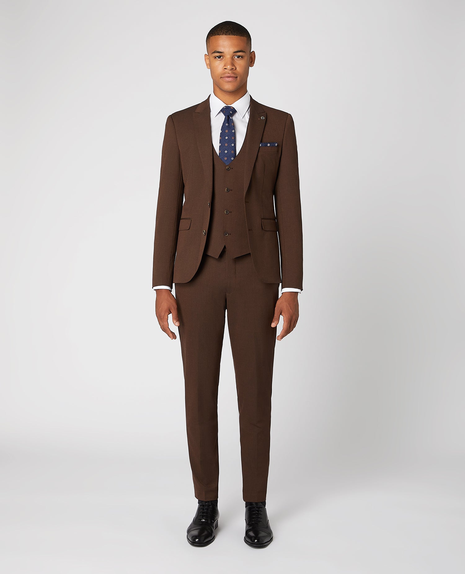 Man wearing a brown X-Slim Fit 2-Piece Stretch Suit
