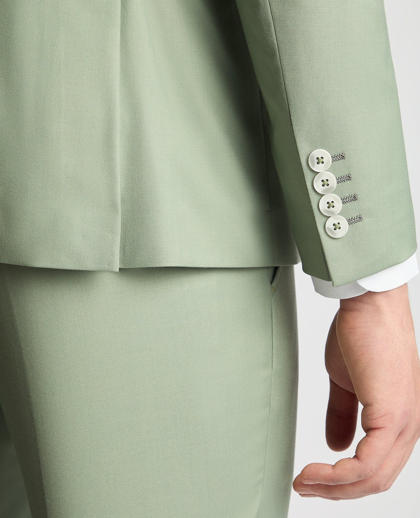 Man wearing a green X-Slim Two Piece Stretch Suit