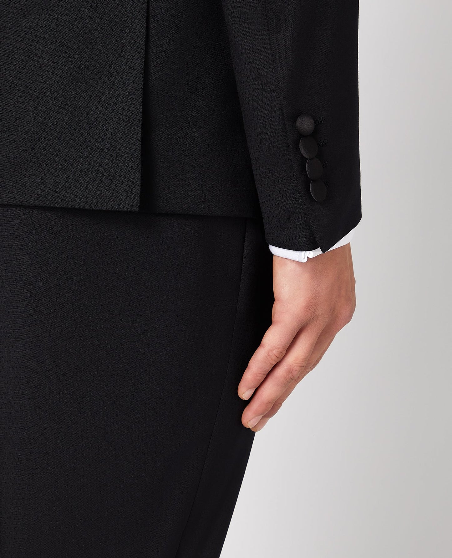 Man wearing a black Slim Fit Wool-Rich Mix and Match Dinner Suit