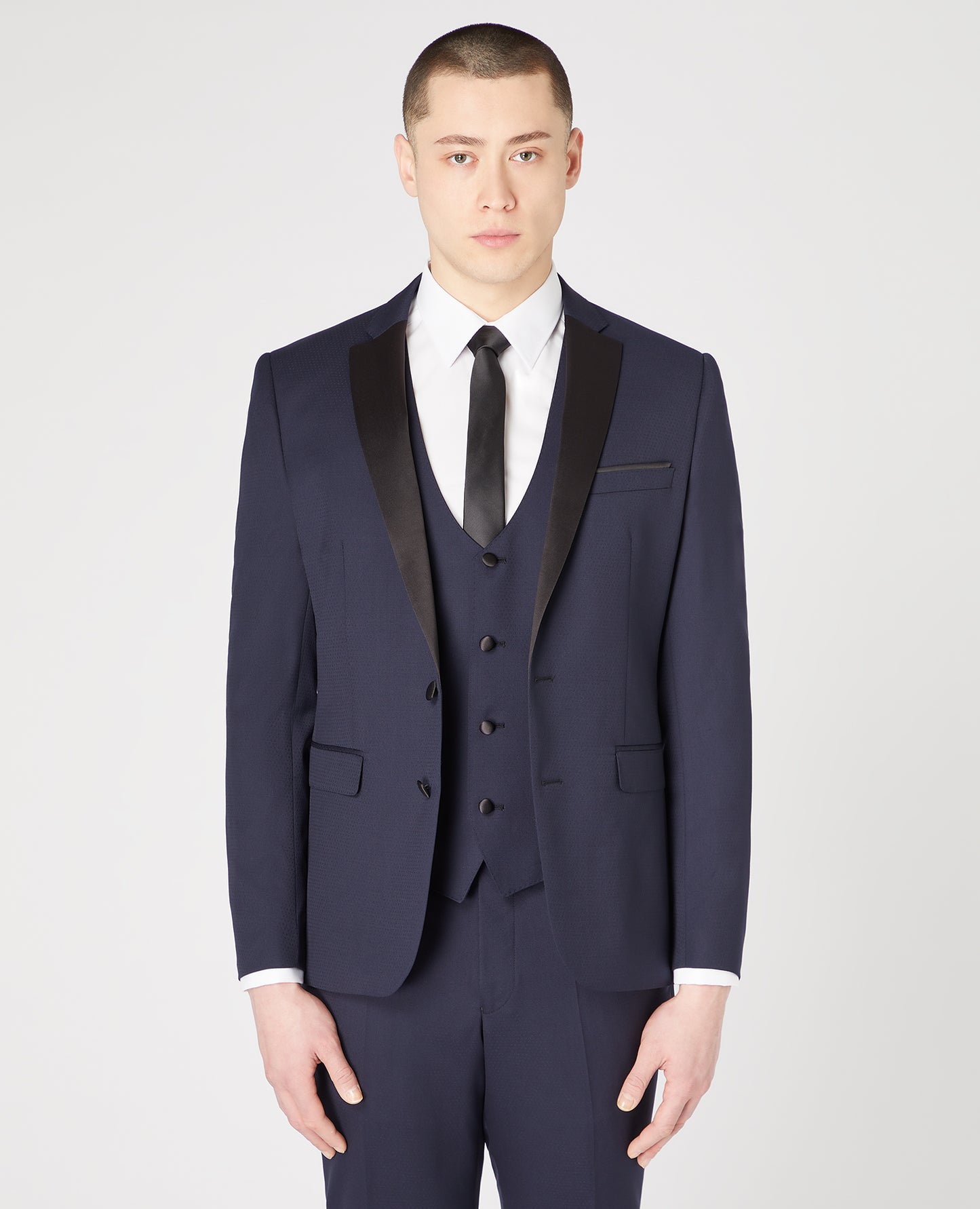 Man wearing a navy Slim Fit Wool-Rich Mix and Match Dinner Suit Jacket