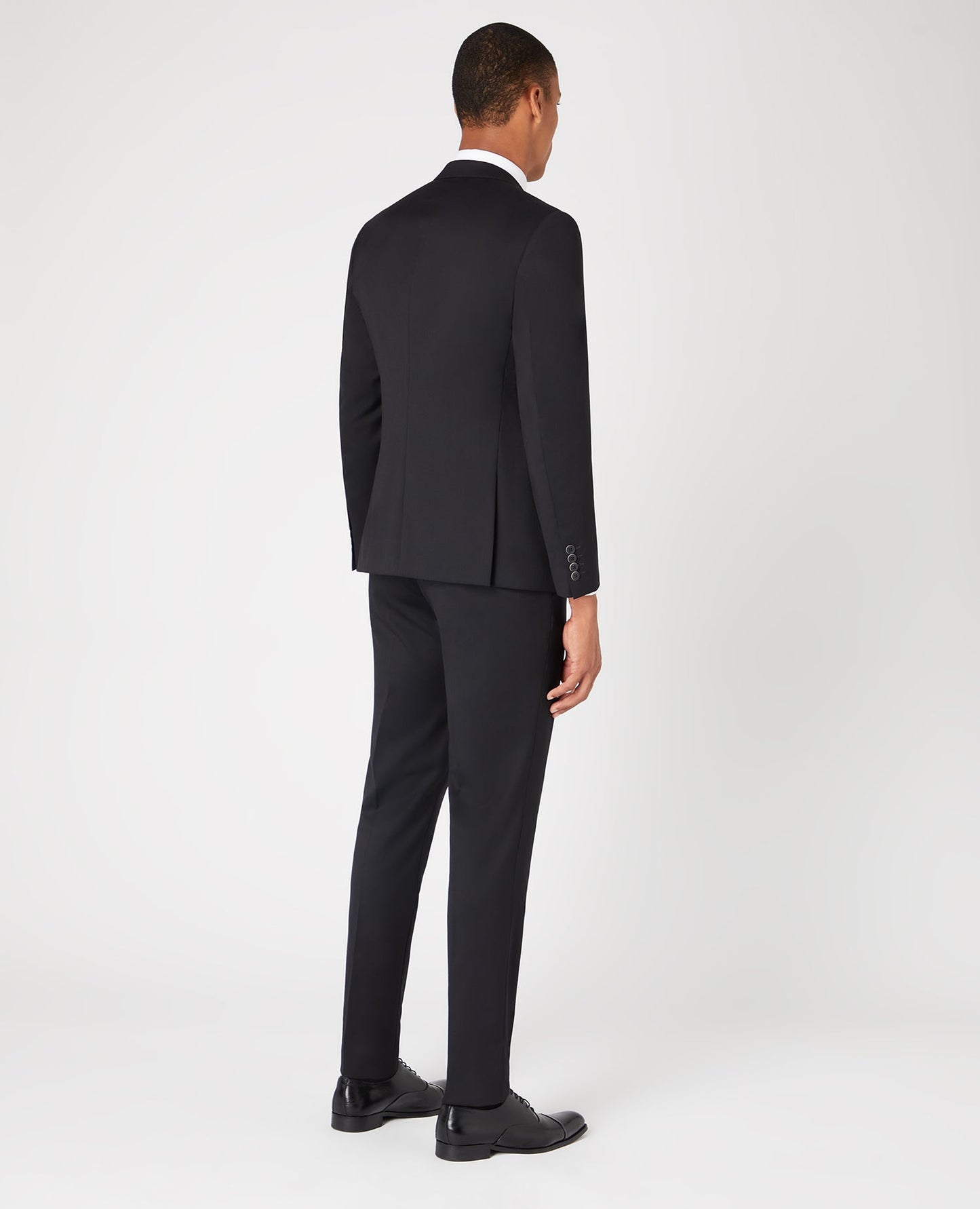 Man wearing a black Slim Fit Wool-Rich Mix and Match Suit Jacket