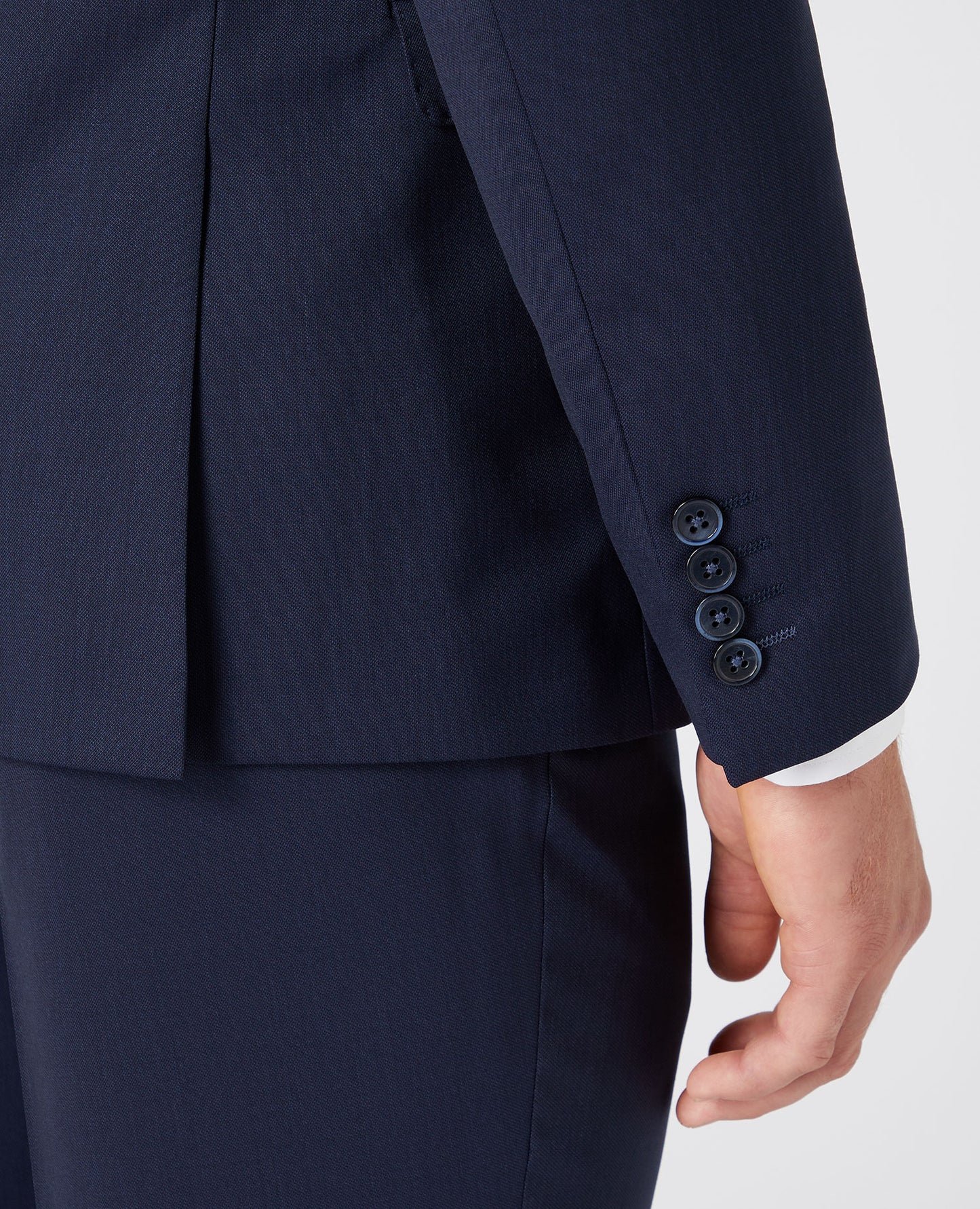 Man wearing a navy Slim Fit Wool-Rich Mix and Match Suit