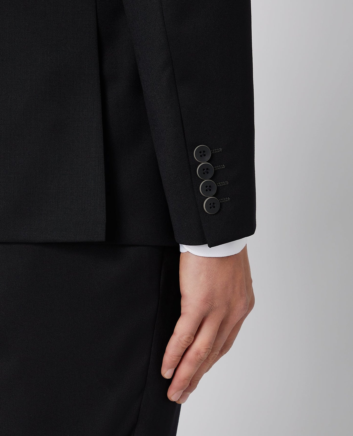 Man wearing a black Tapered Fit Wool-Blend Mix and Match Suit Jacket