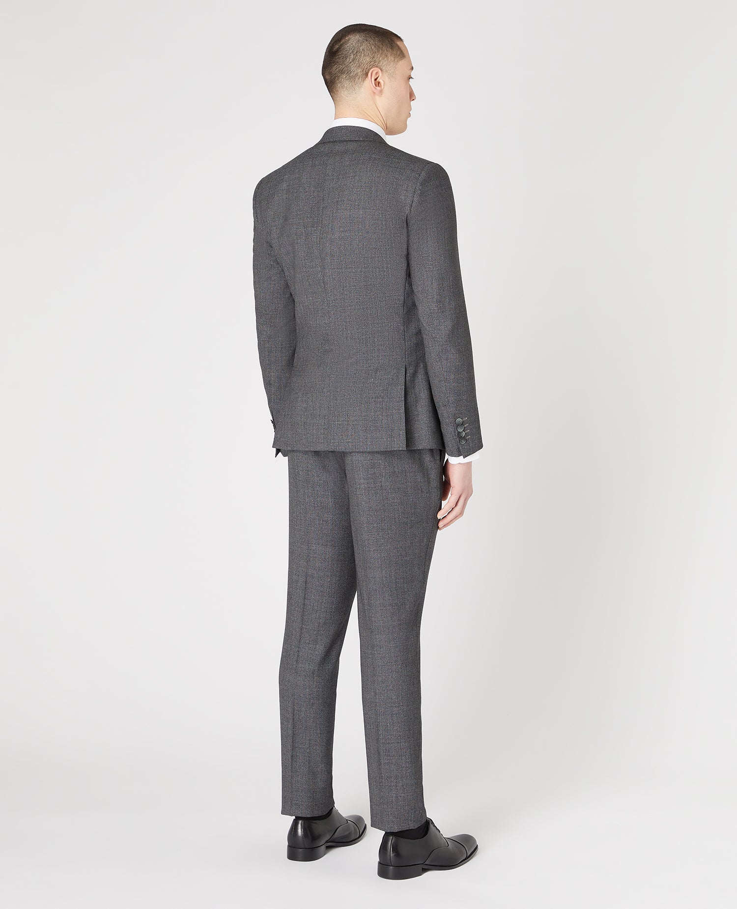 Man wearing a grey Slim Fit Wool-Rich Stretch Mix and Match Suit