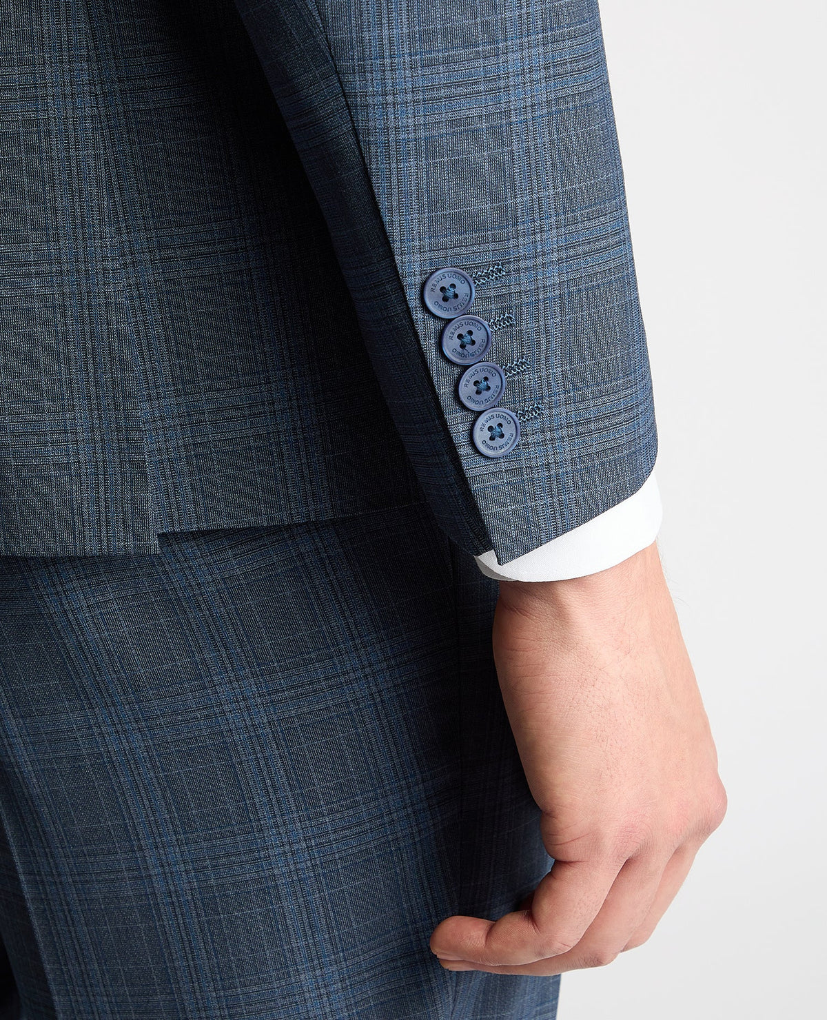 Man wearing a blue Tapered Fit Checked Wool Blend Mix and Match Suit
