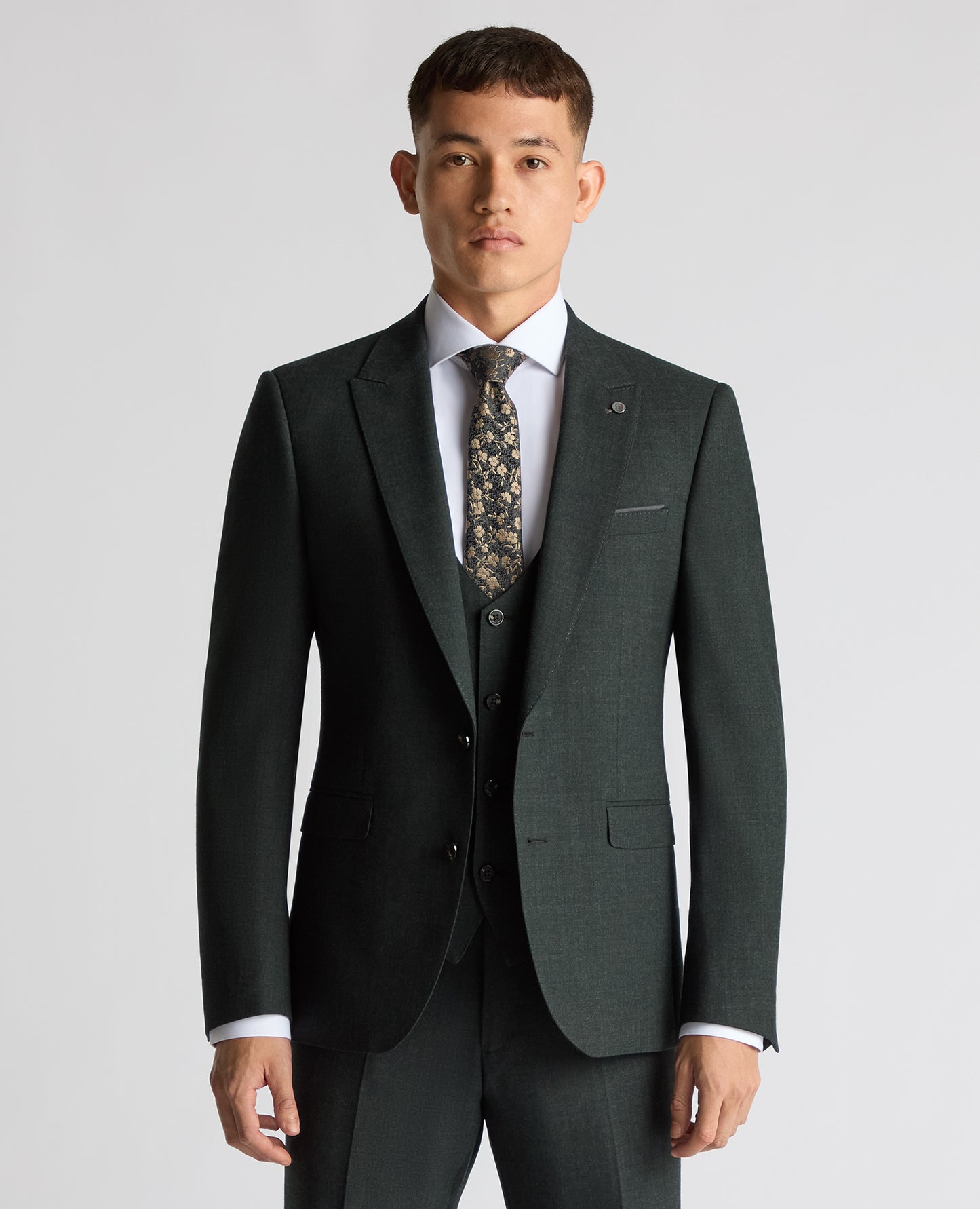 Man wearing a green Slim Fit Wool Stretch Suit