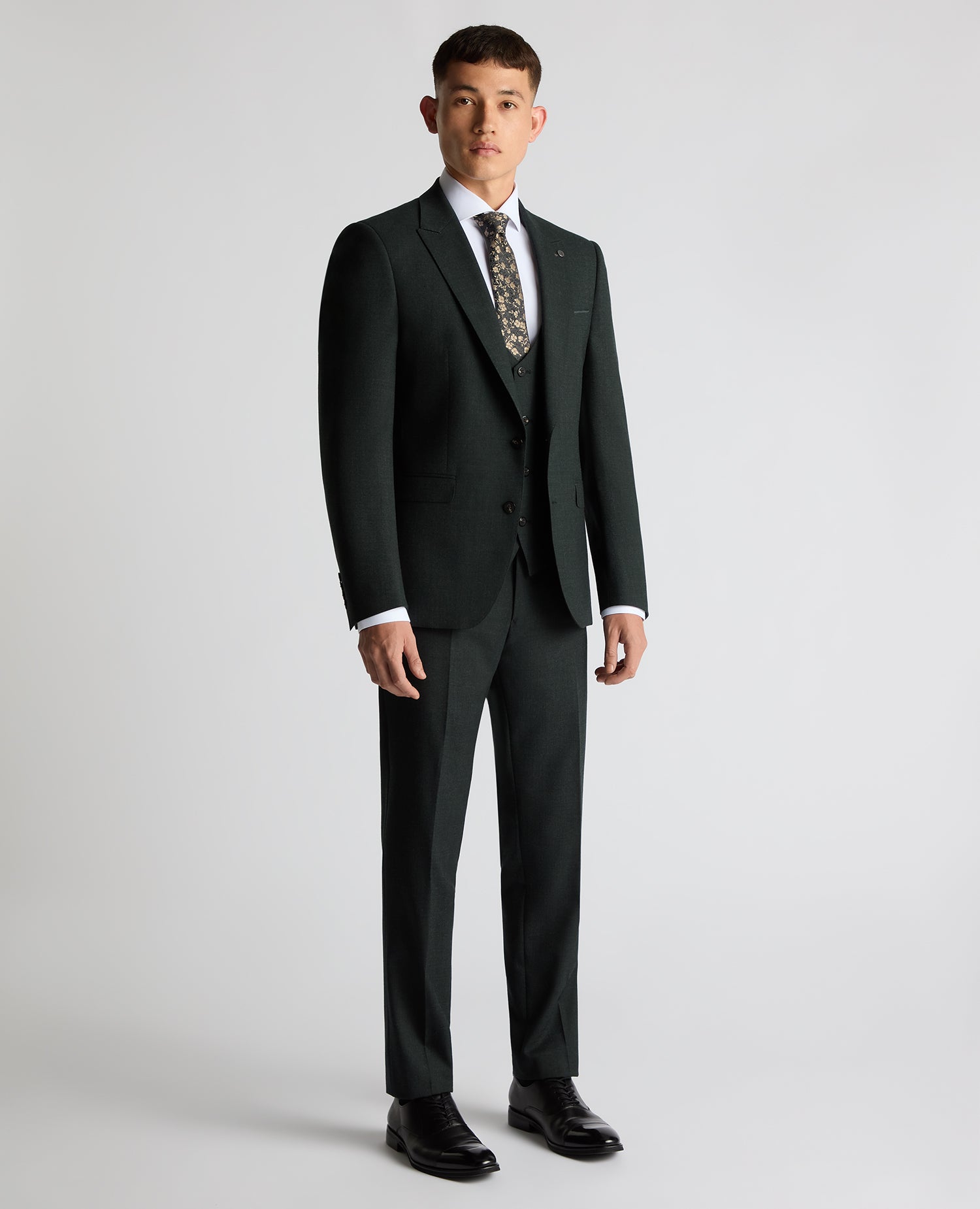 Man wearing a green Slim Fit Wool Stretch Suit