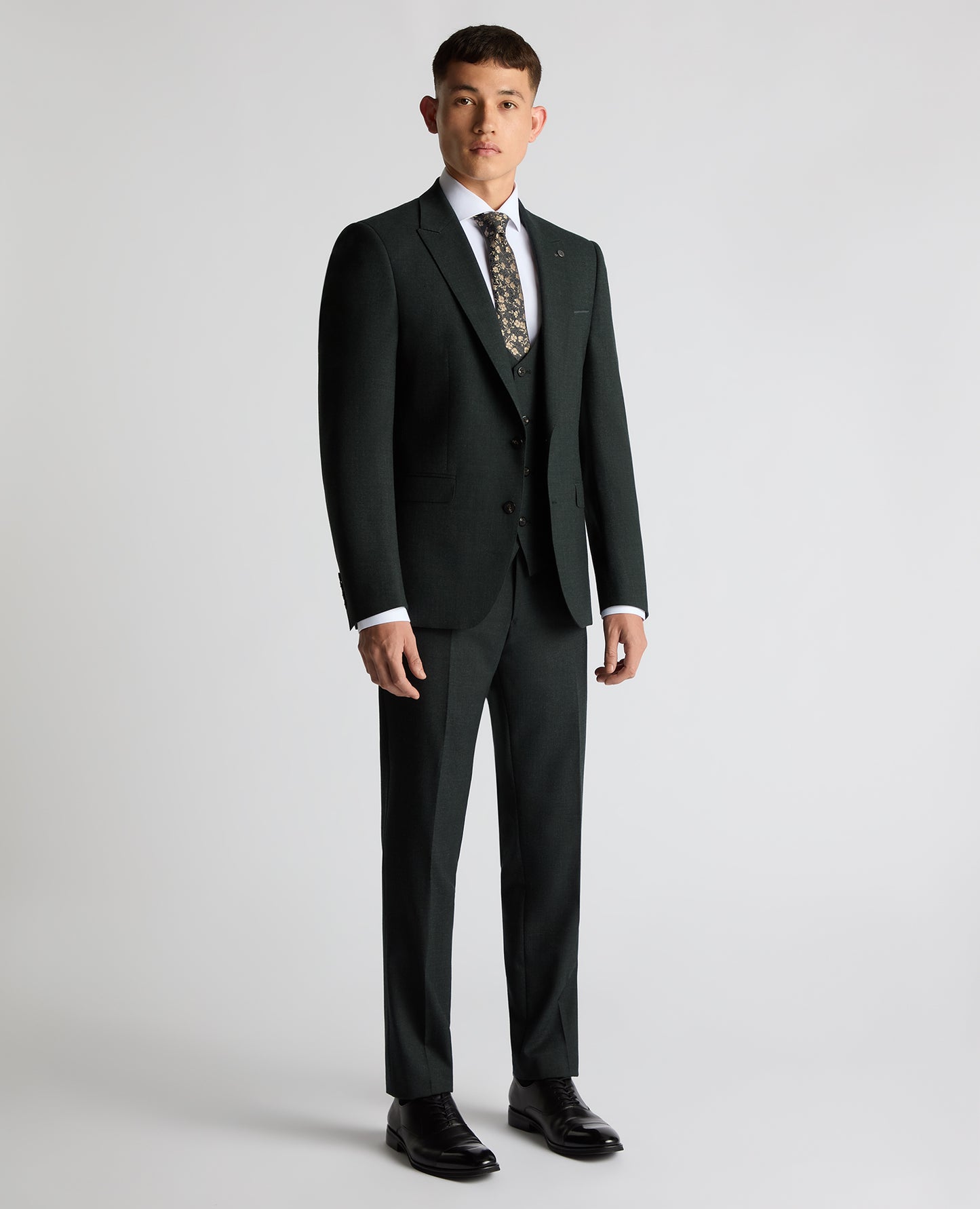 Man wearing a green Slim Fit Wool Stretch Suit