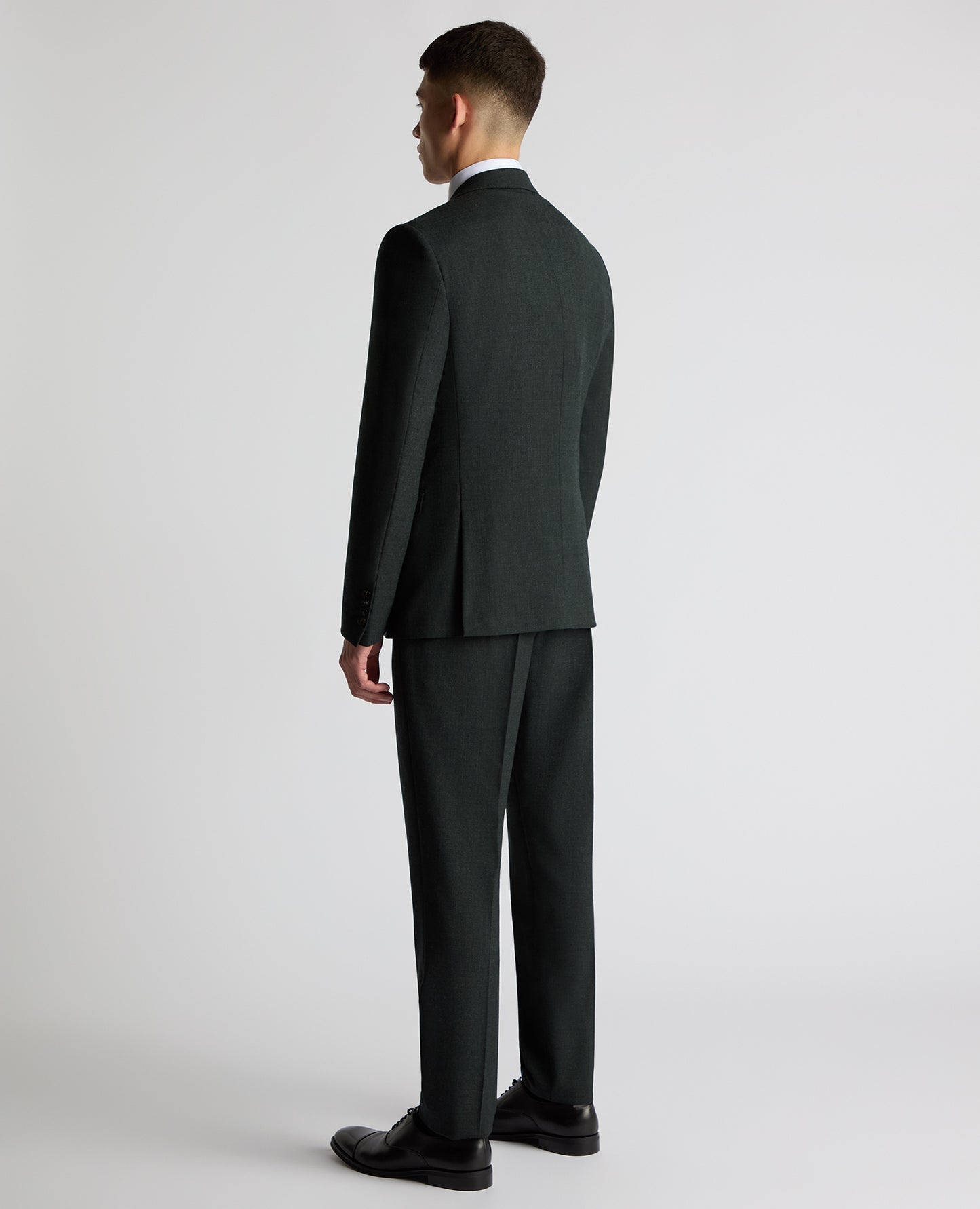 Man wearing a green Slim Fit Wool Stretch Suit