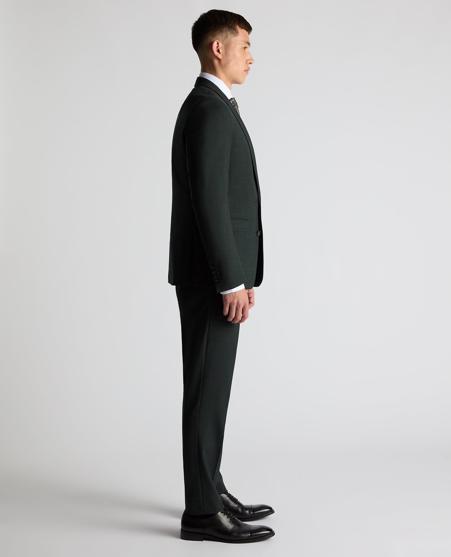 Man wearing a green Slim Fit Wool Stretch Suit