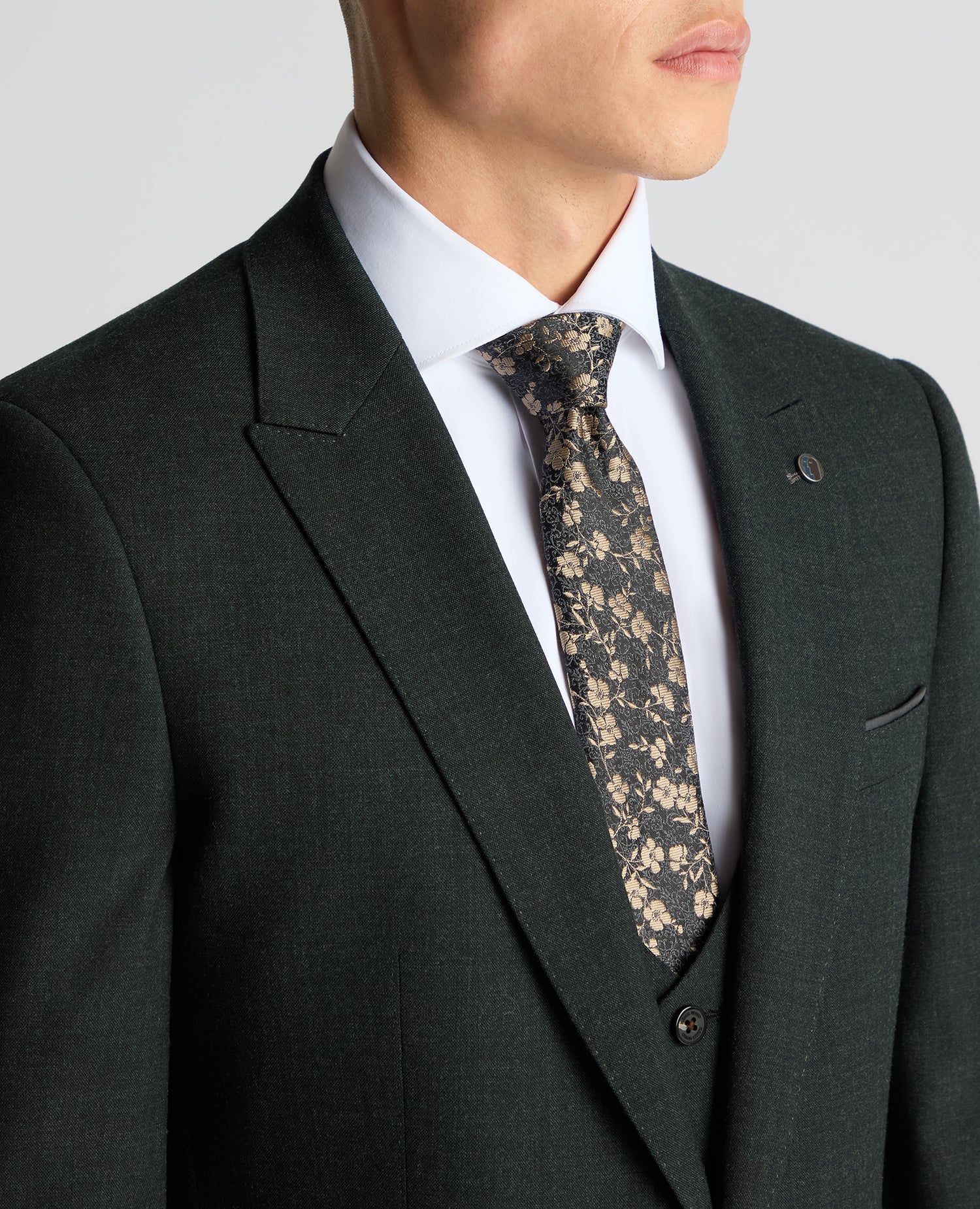 Man wearing a green Slim Fit Wool Stretch Suit