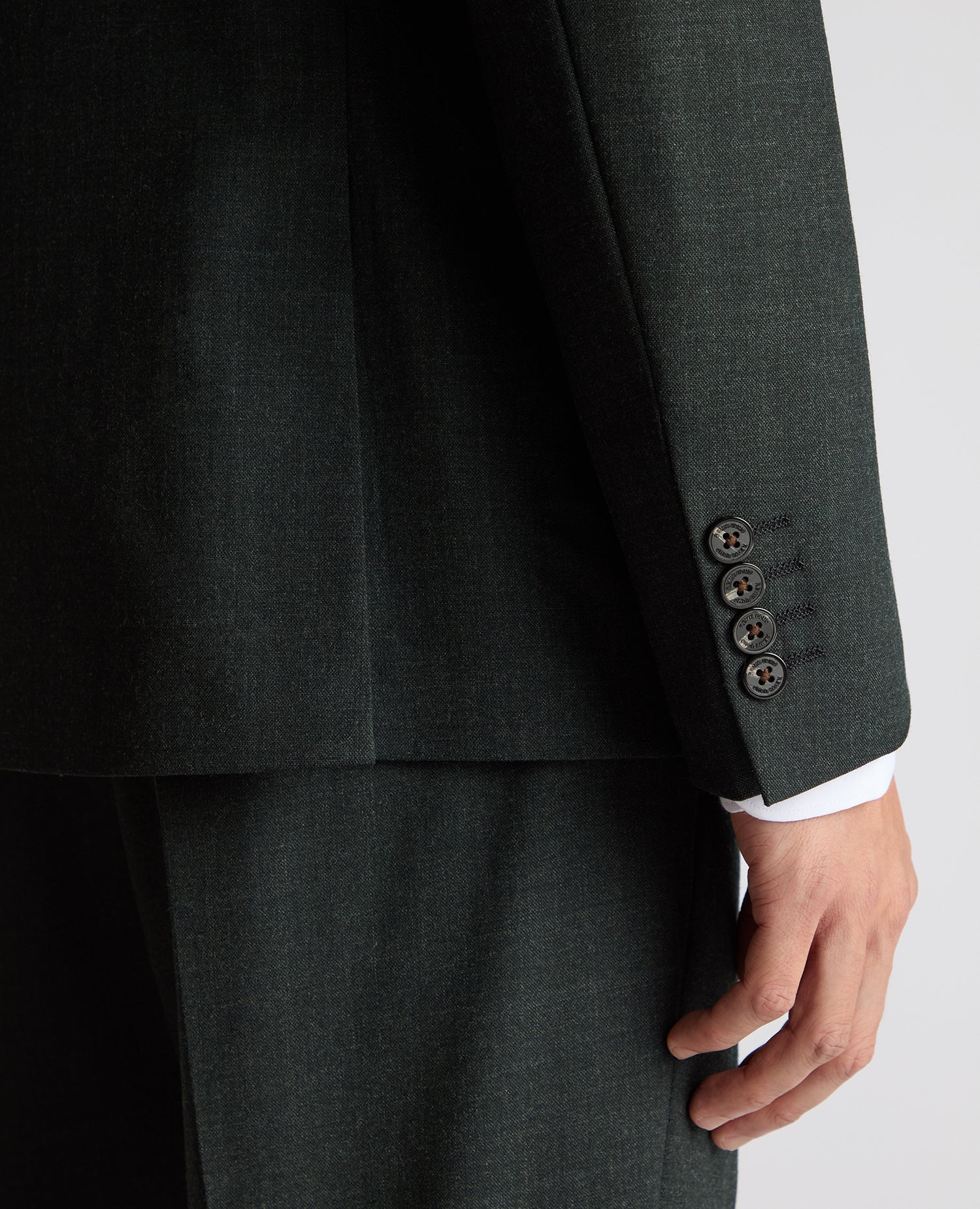 Man wearing a green Slim Fit Wool Stretch Suit