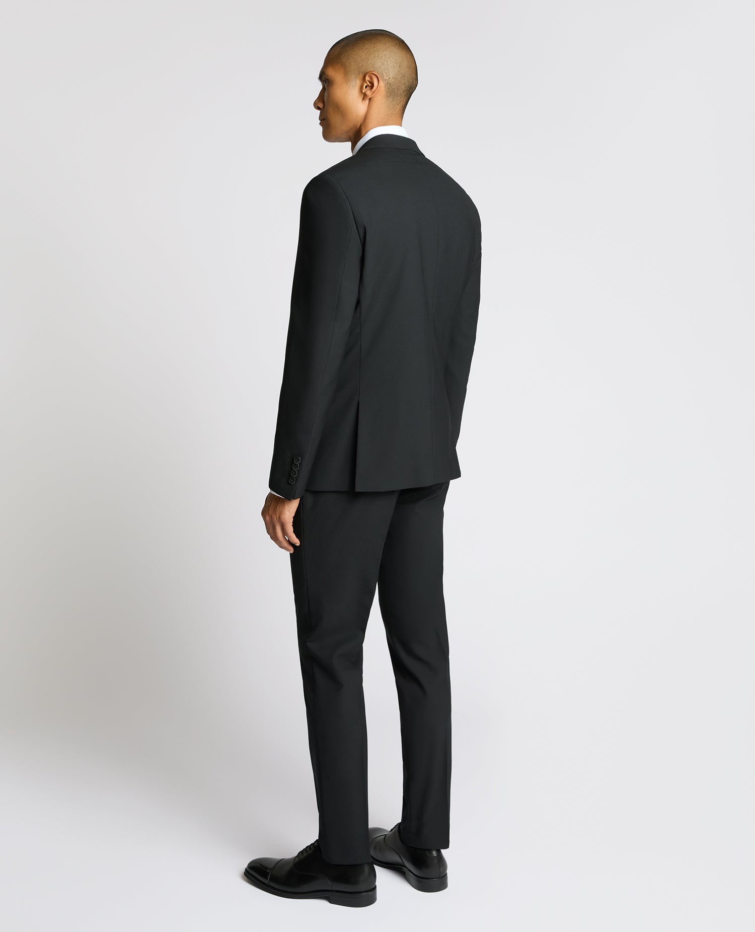 Man wearing a black Slim Fit Wool-Blend Suit