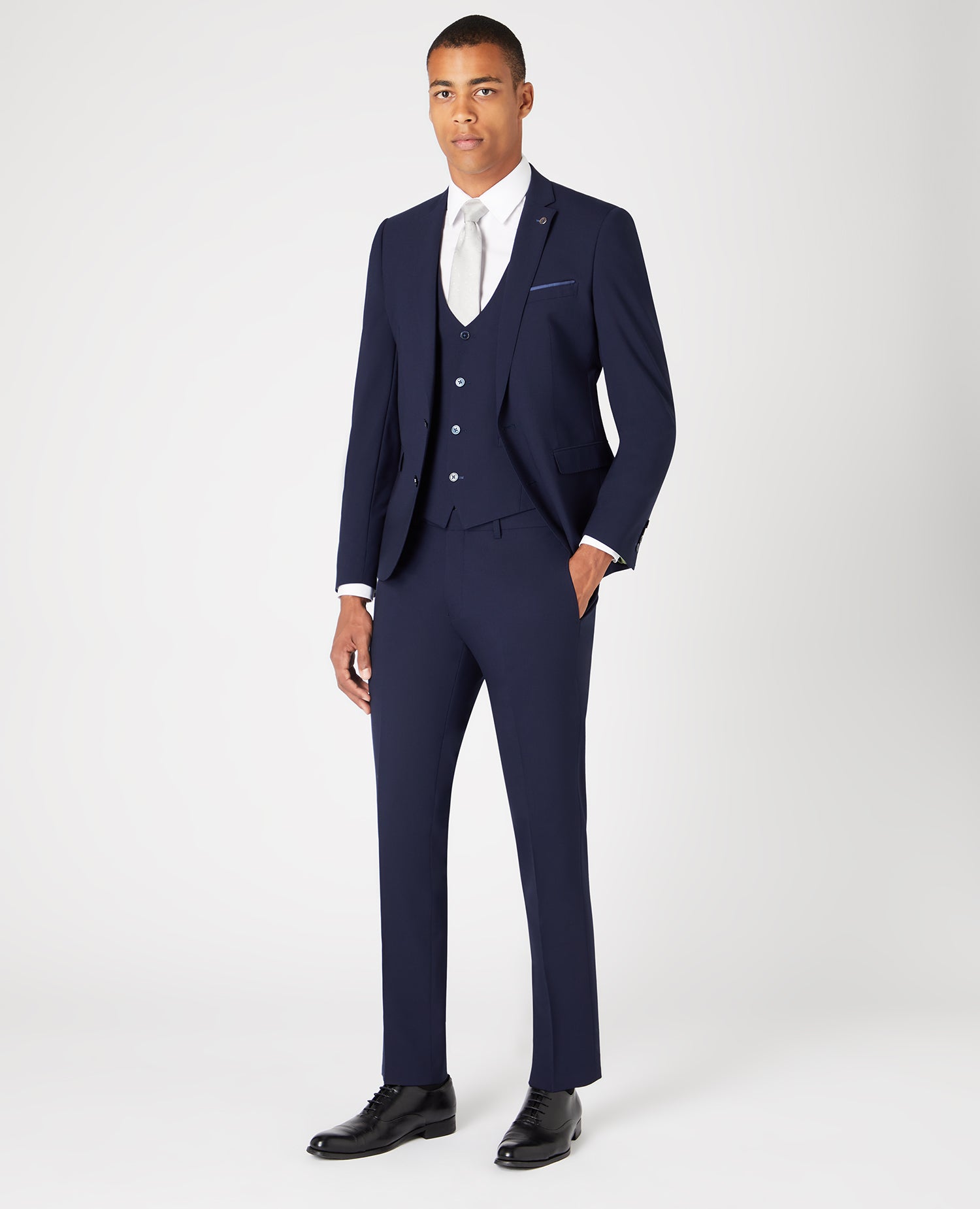 Man wearing a navy Slim Fit Wool-Rich Stretch Mix and Match Suit