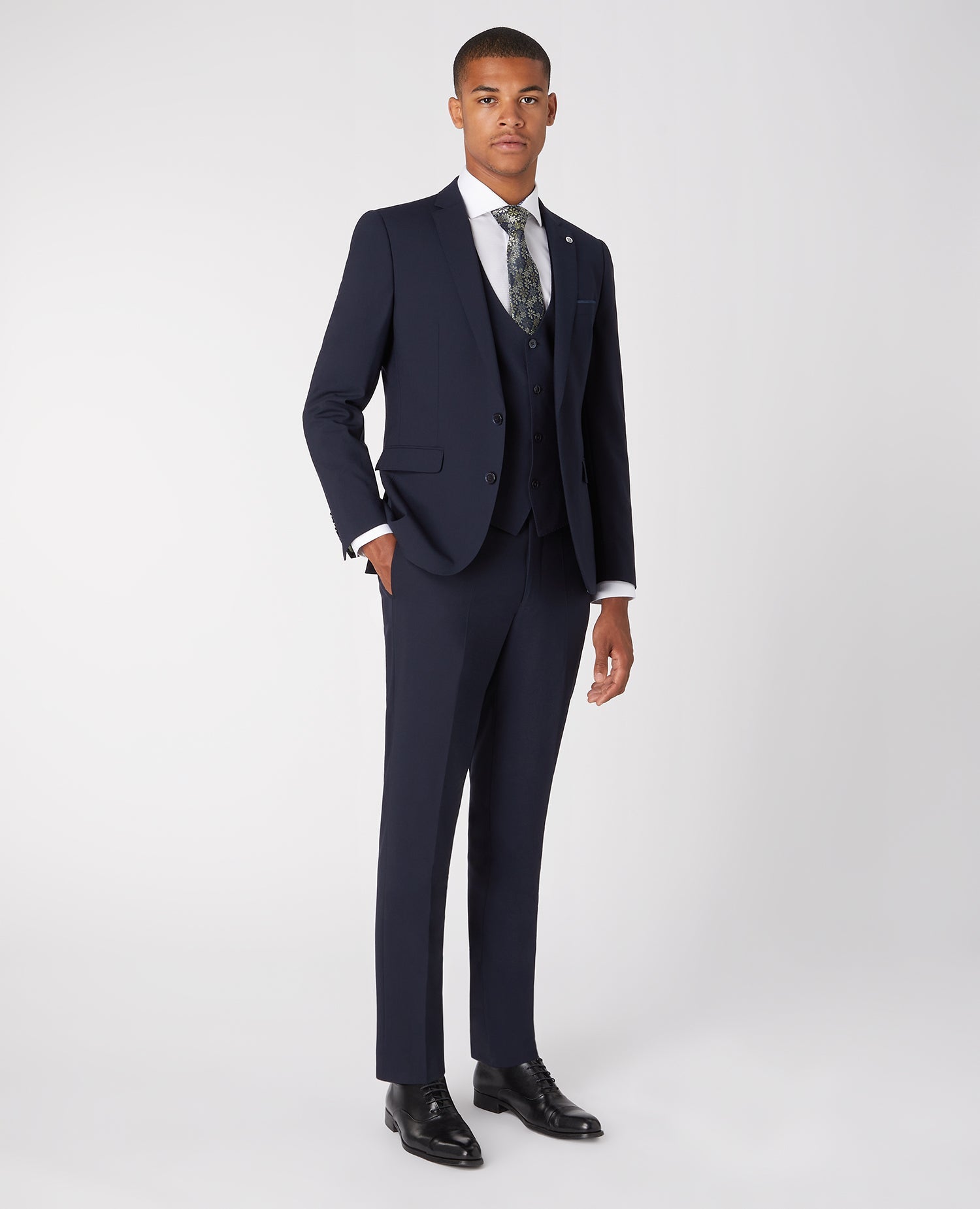 Man wearing a navy Slim Fit Wool-Rich Stretch Mix and Match Suit Jacket