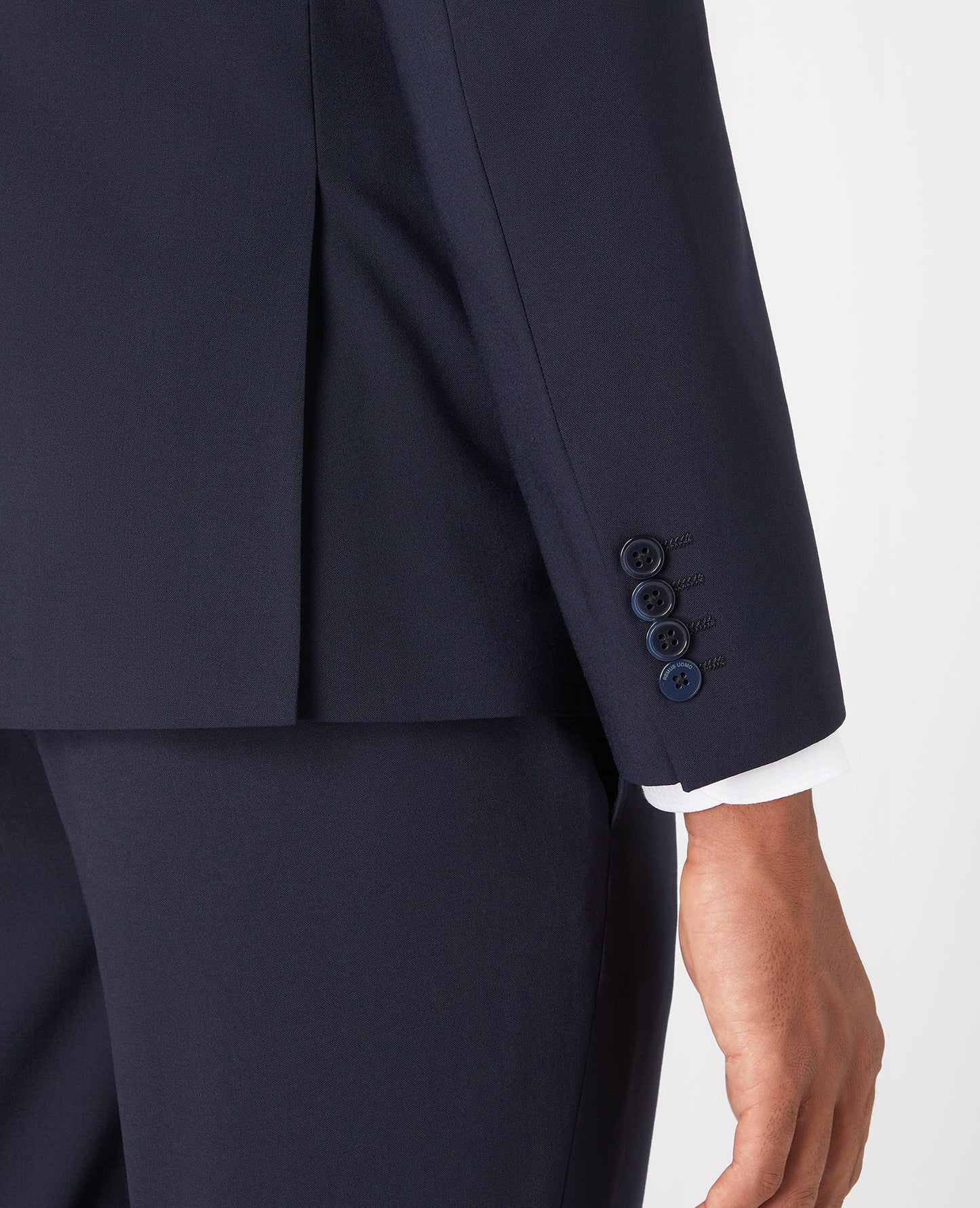 Man wearing a navy Slim Fit Wool-Rich Stretch Mix and Match Suit Jacket