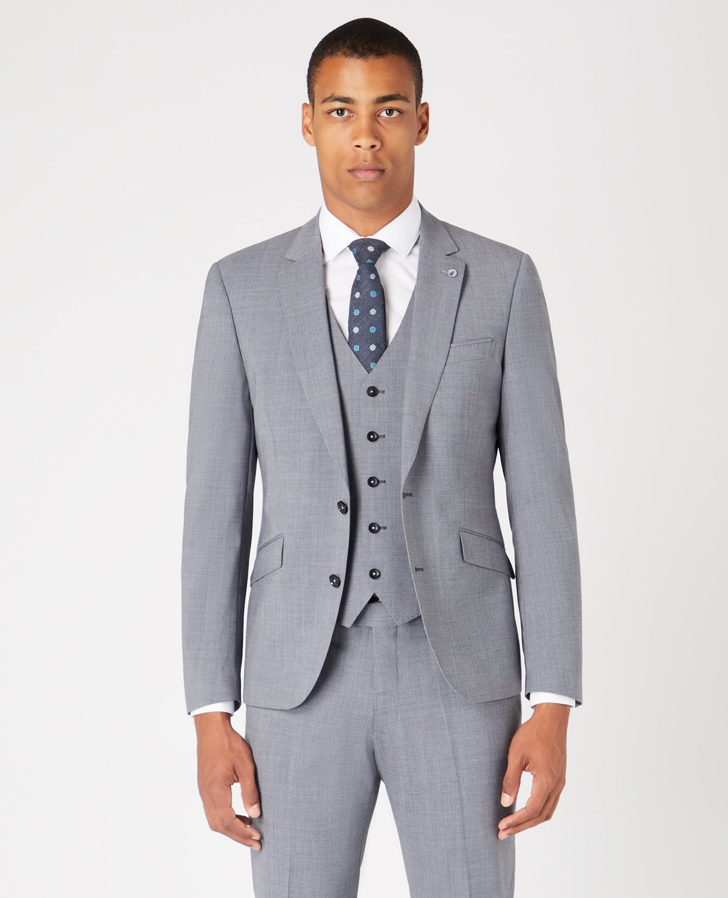 Man wearing a grey Tapered Fit Wool-Rich Stretch Mix and Match Suit Jacket