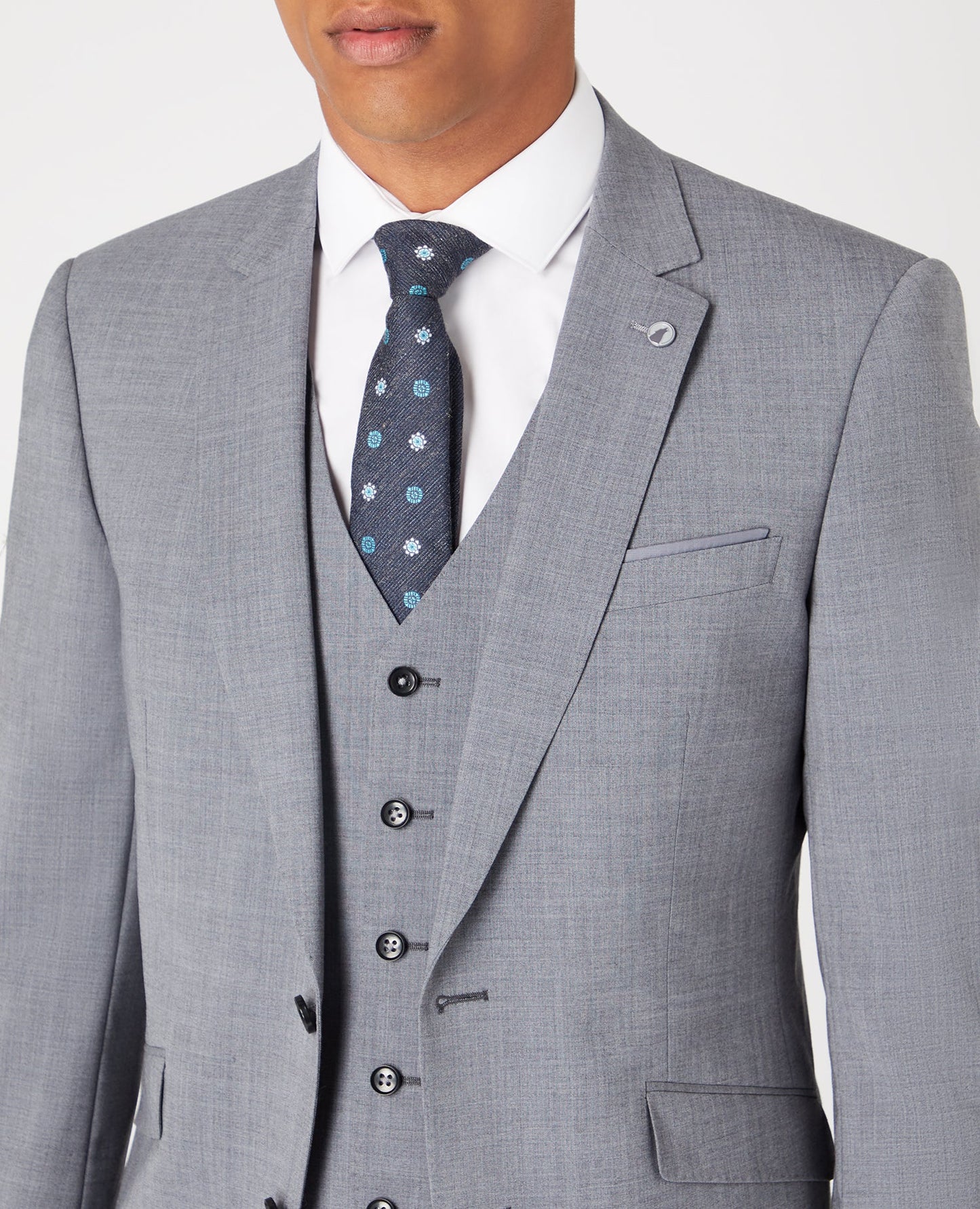 Man wearing a grey Tapered Fit Wool-Rich Stretch Mix and Match Suit Jacket