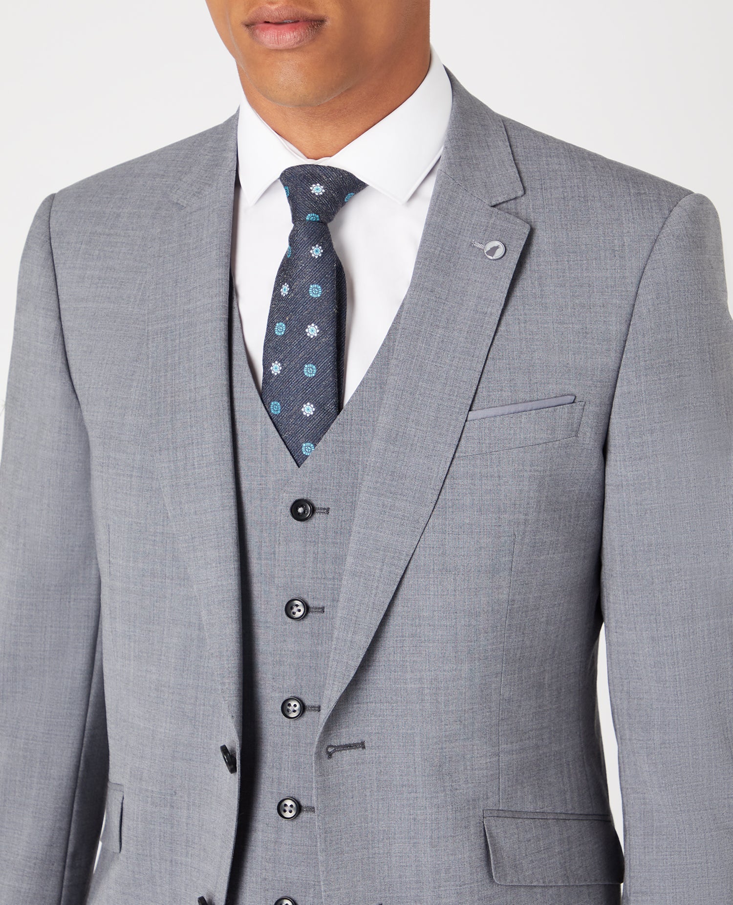 Man wearing a grey Tapered Fit Wool-Rich Stretch Mix and Match Suit Jacket