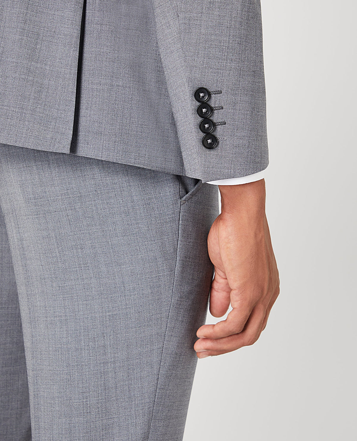 Man wearing a grey Tapered Fit Wool-Rich Stretch Mix and Match Suit Jacket