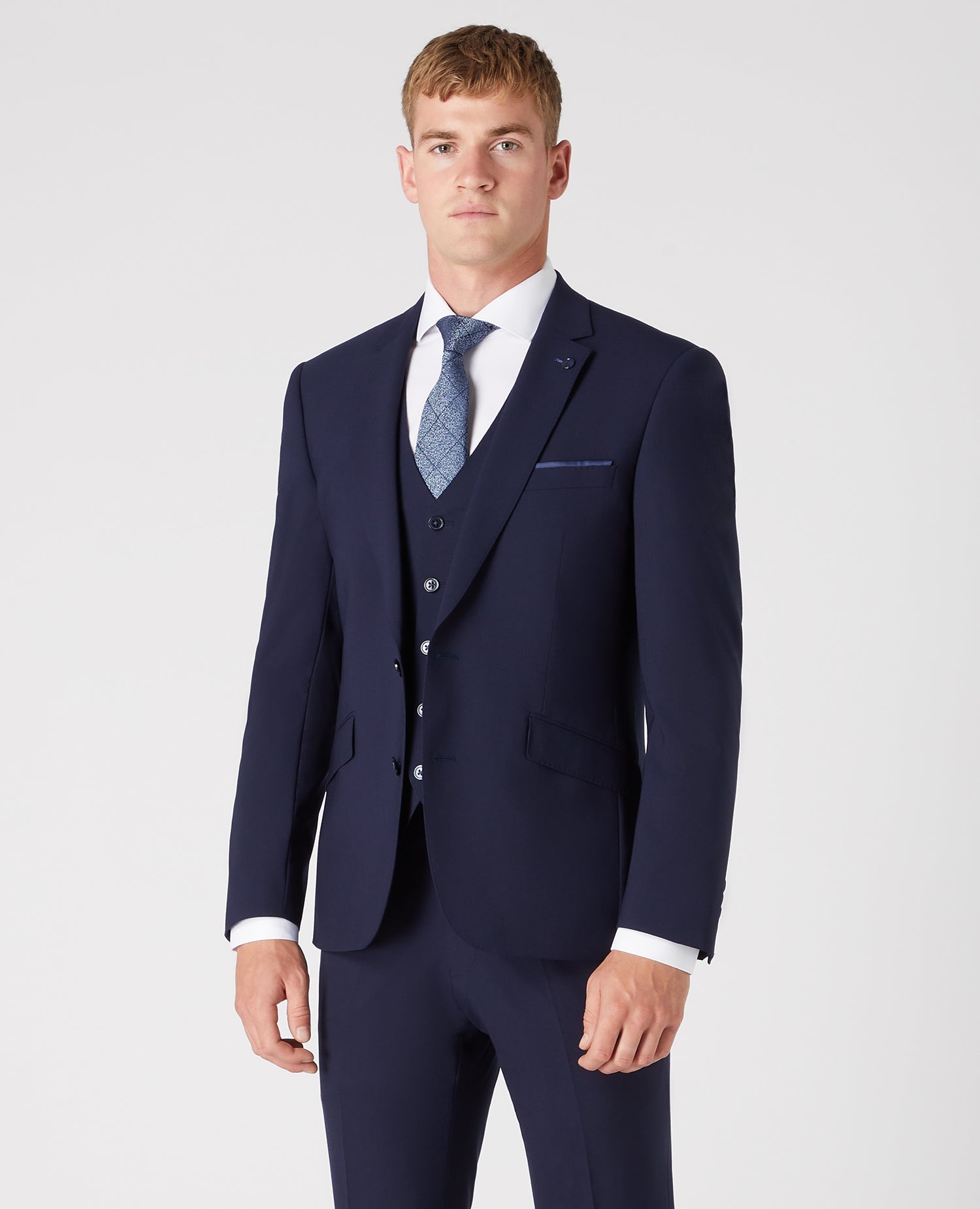 Man wearing a navy Tapered Fit Wool-Rich Stretch Mix and Match